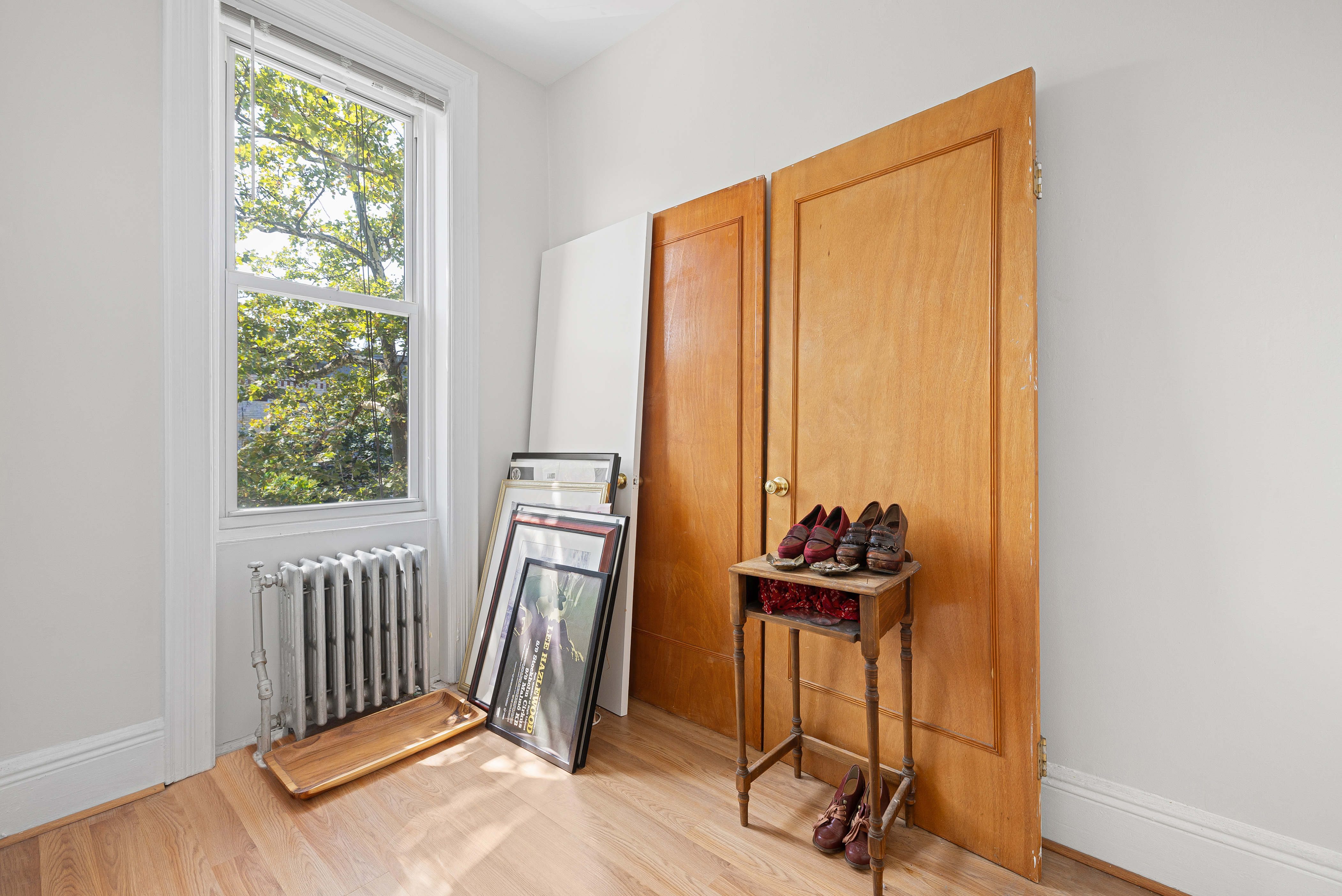59-47 Madison Street, Unit 2 Queens, NY 11385 - Photo 9 of 12 a view of a workspace with furniture and a window