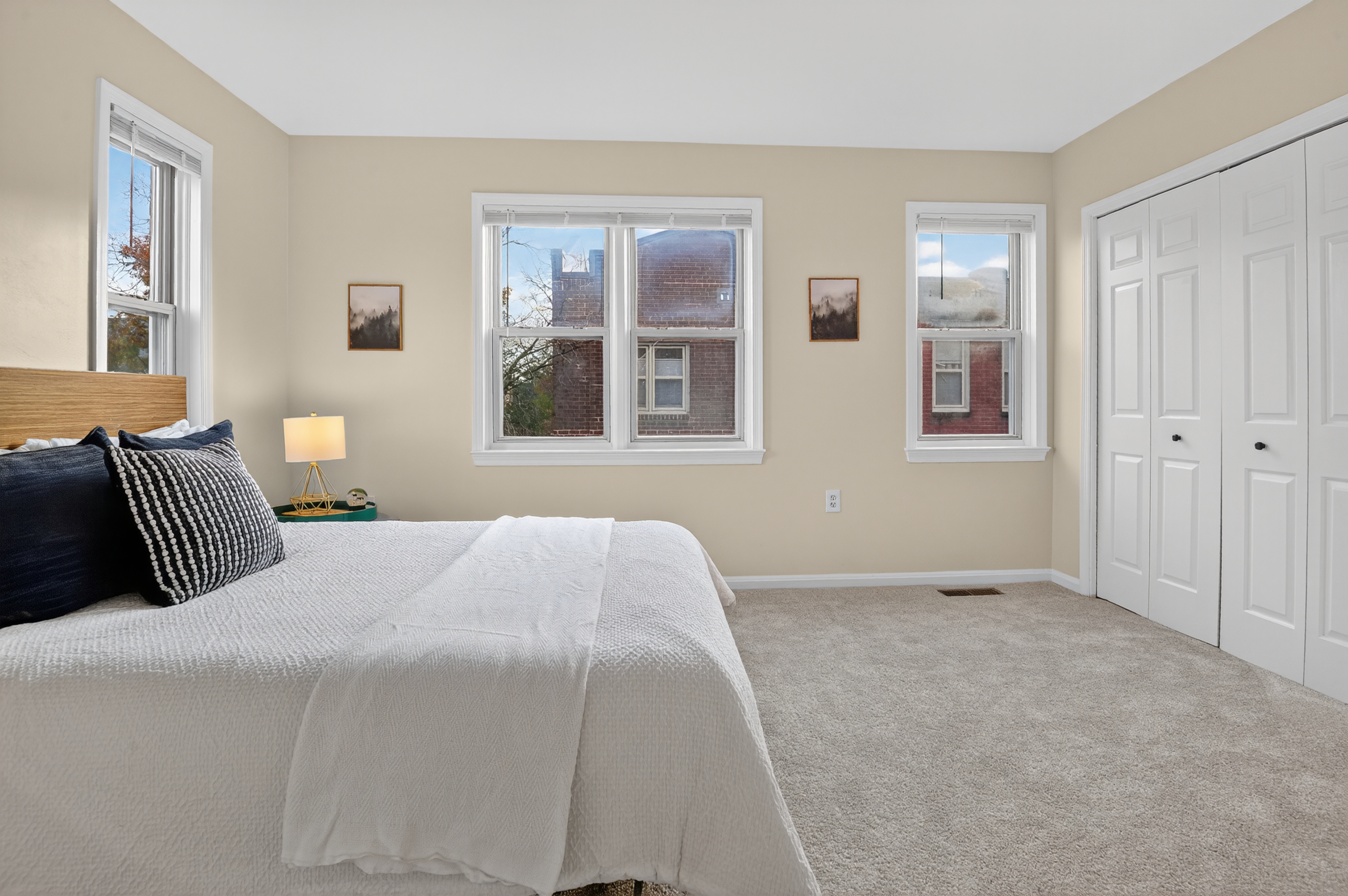 1493 15th Street Northeast, Unit 1493 Washington, DC 20002 - Photo 22 of 26 a bedroom with a bed and a window