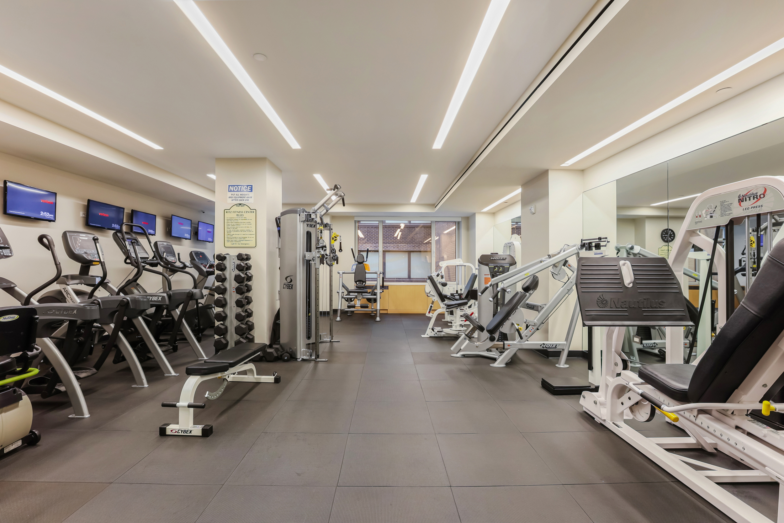 465 Park Avenue, Unit 409 Manhattan, NY 10022 - Photo 8 of 11 a view of a room with gym equipment