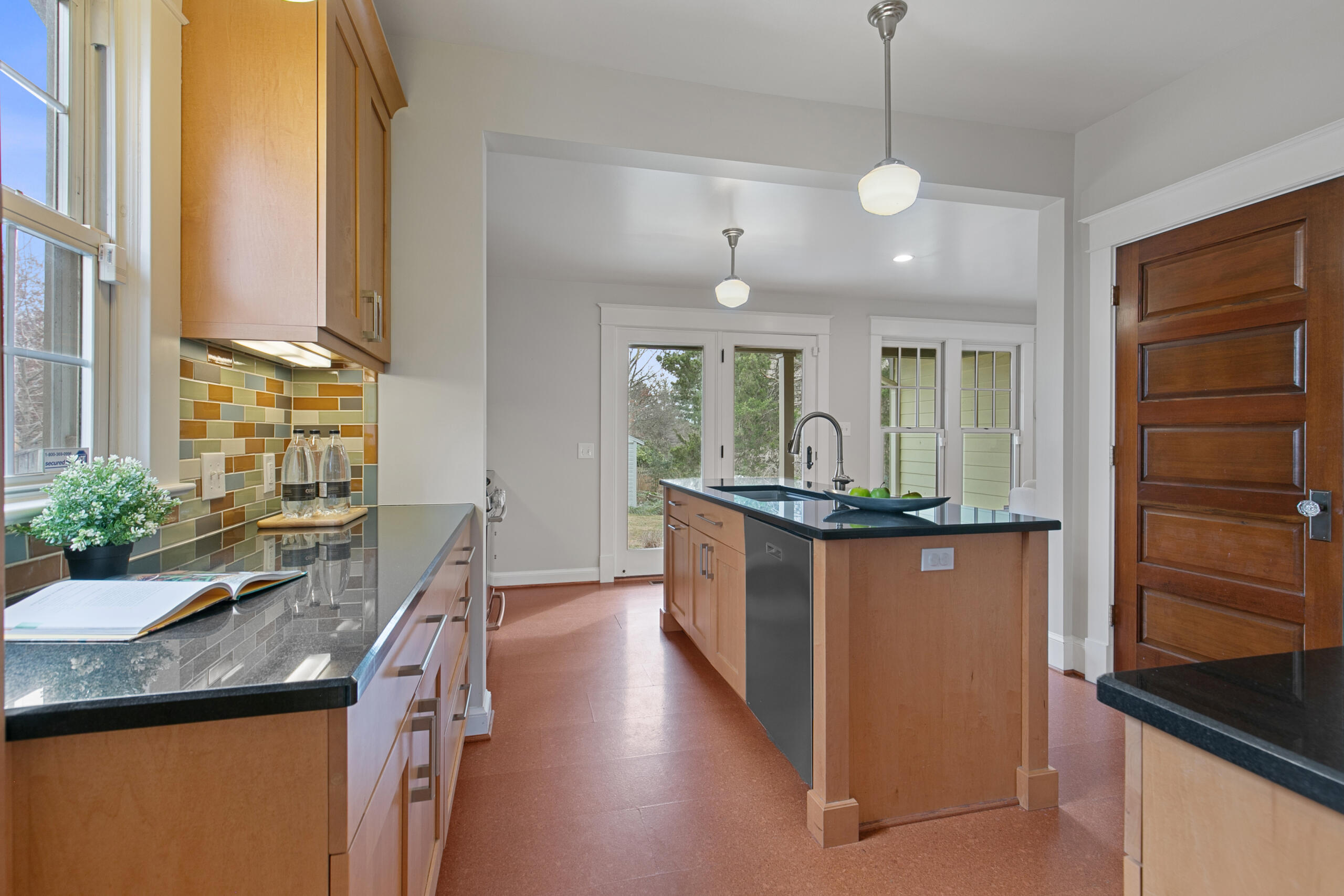 1908 Glen Ross Road Silver Spring, MD 20910 - Photo 20 of 63 a kitchen with stainless steel appliances granite countertop a sink a stove and a wooden floors
