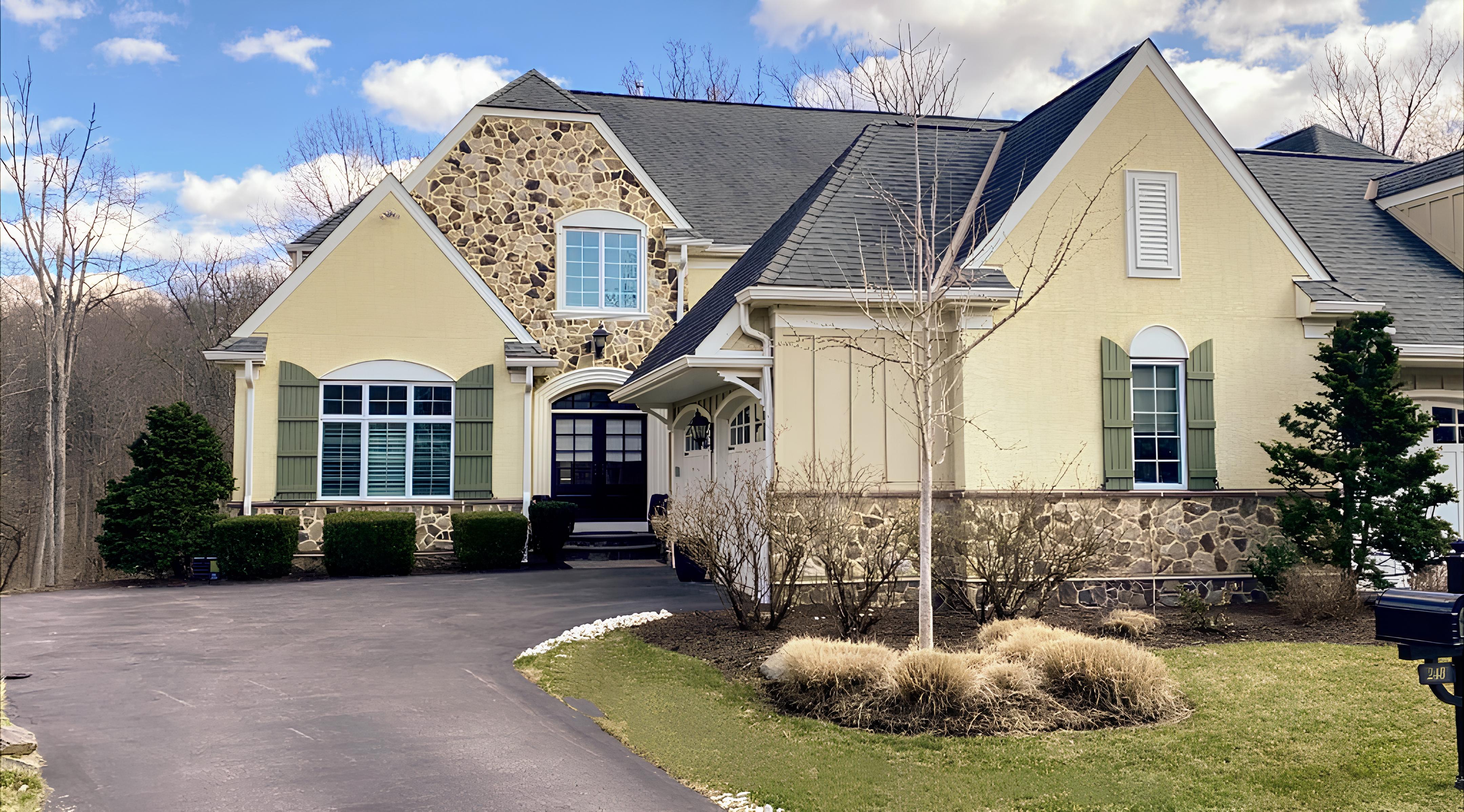 a view of a house with pool and sitting area