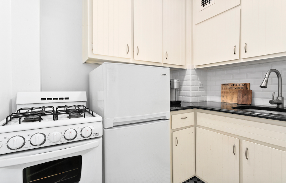 54 Orange Street, Unit 6D Brooklyn, NY 11201 - Photo 3 of 9 a white stove top oven sitting inside of a kitchen