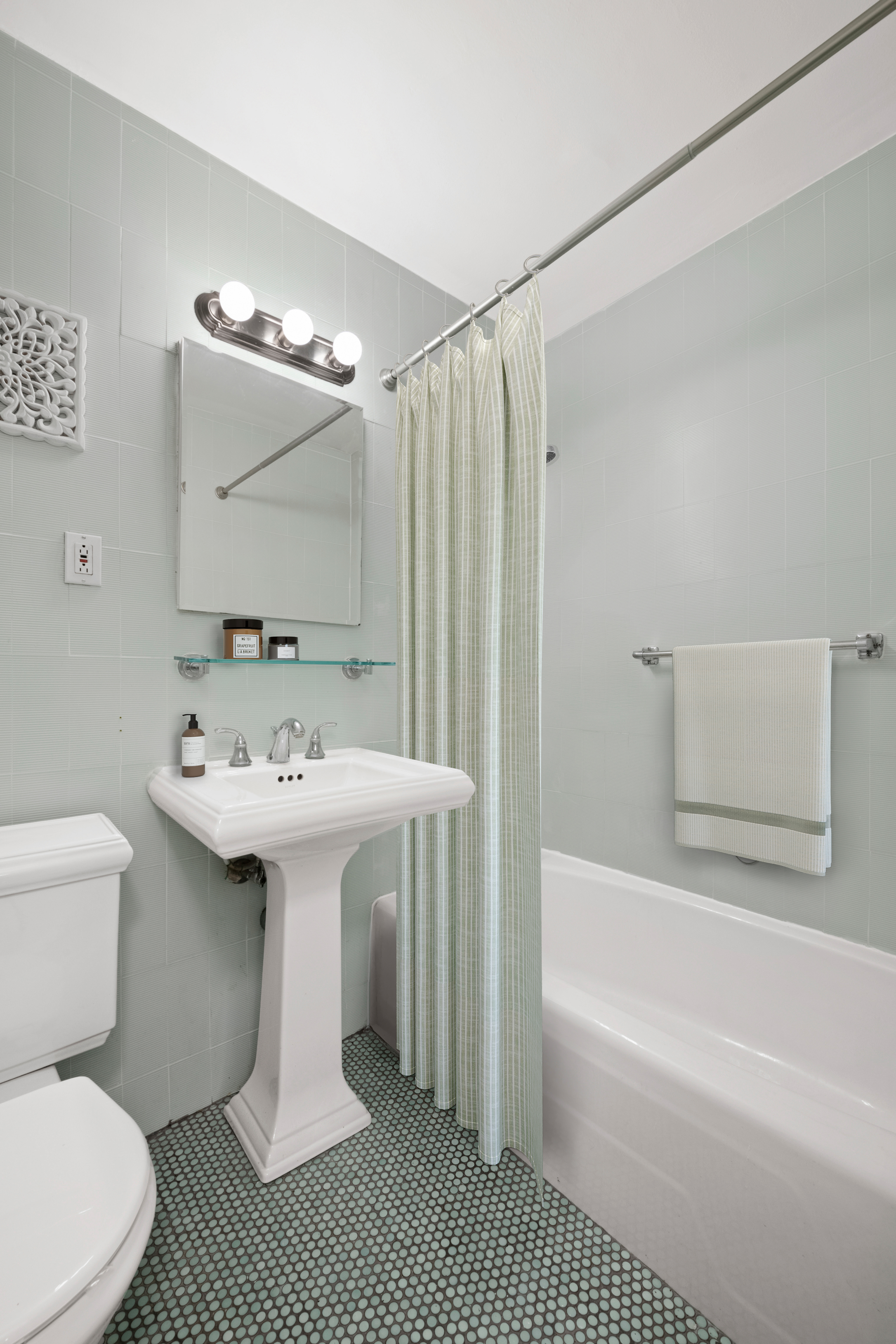 170 West End Avenue, Unit 15L Manhattan, NY 10023 - Photo 5 of 11 a bathroom with a sink toilet and shower