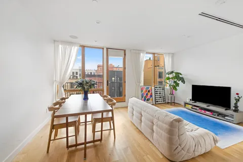 a living room with furniture fireplace and a flat screen tv