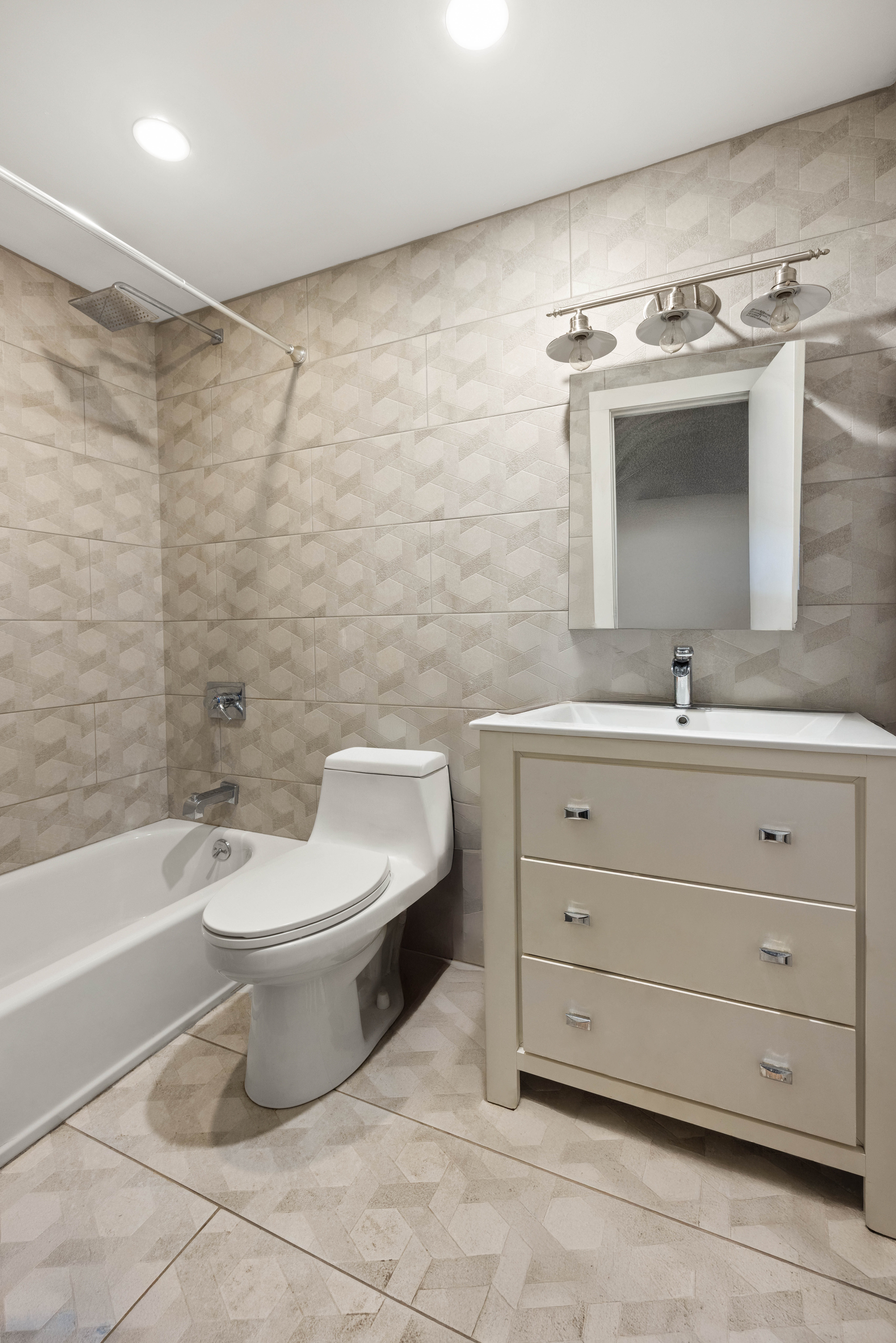 750 Lincoln Place Brooklyn, NY 11216 - Photo 23 of 24 a bathroom with a toilet sink and mirror