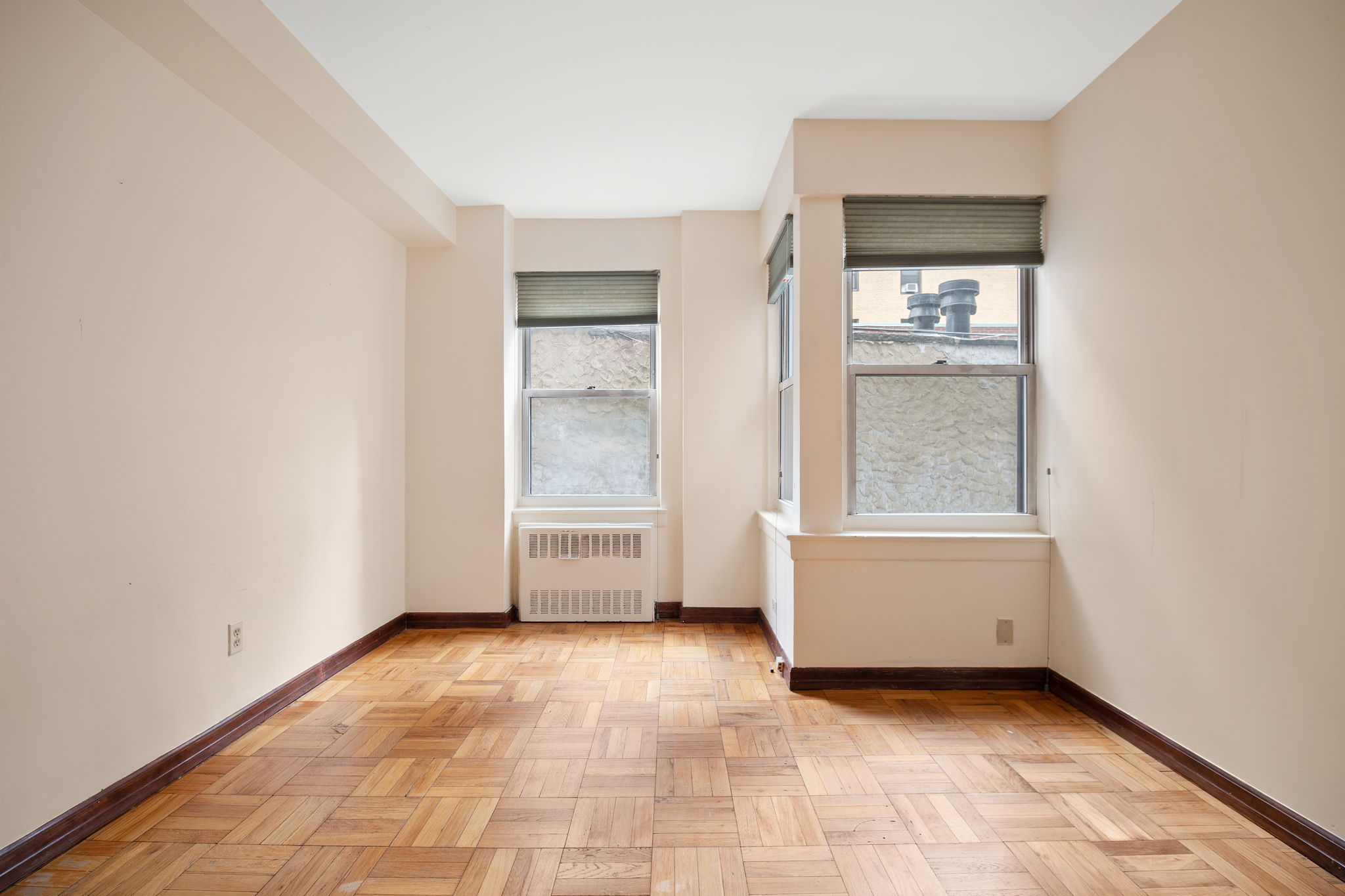 155 East 38th Street, Unit 5L Manhattan, NY 10016 - Photo 6 of 9 a view of an empty room with a window