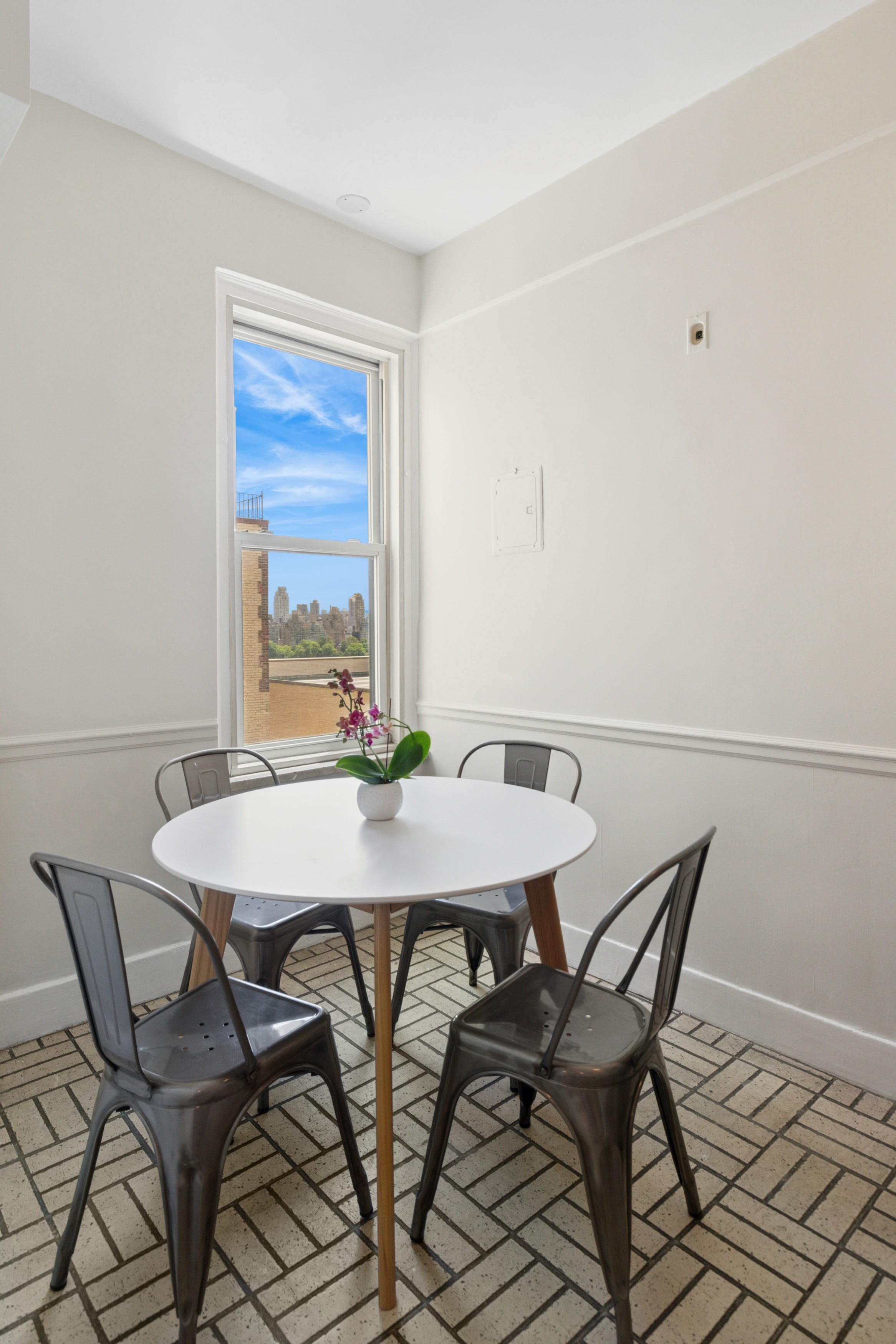 336 Central Park West, Unit 16F Manhattan, NY 10025 - Photo 7 of 18 a view of a dining room with furniture and window