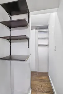 a view of an empty walk in closet
