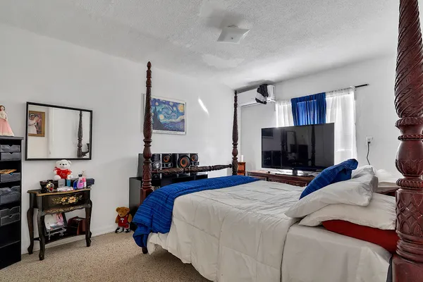 a view of a house with wooden stairs and a table