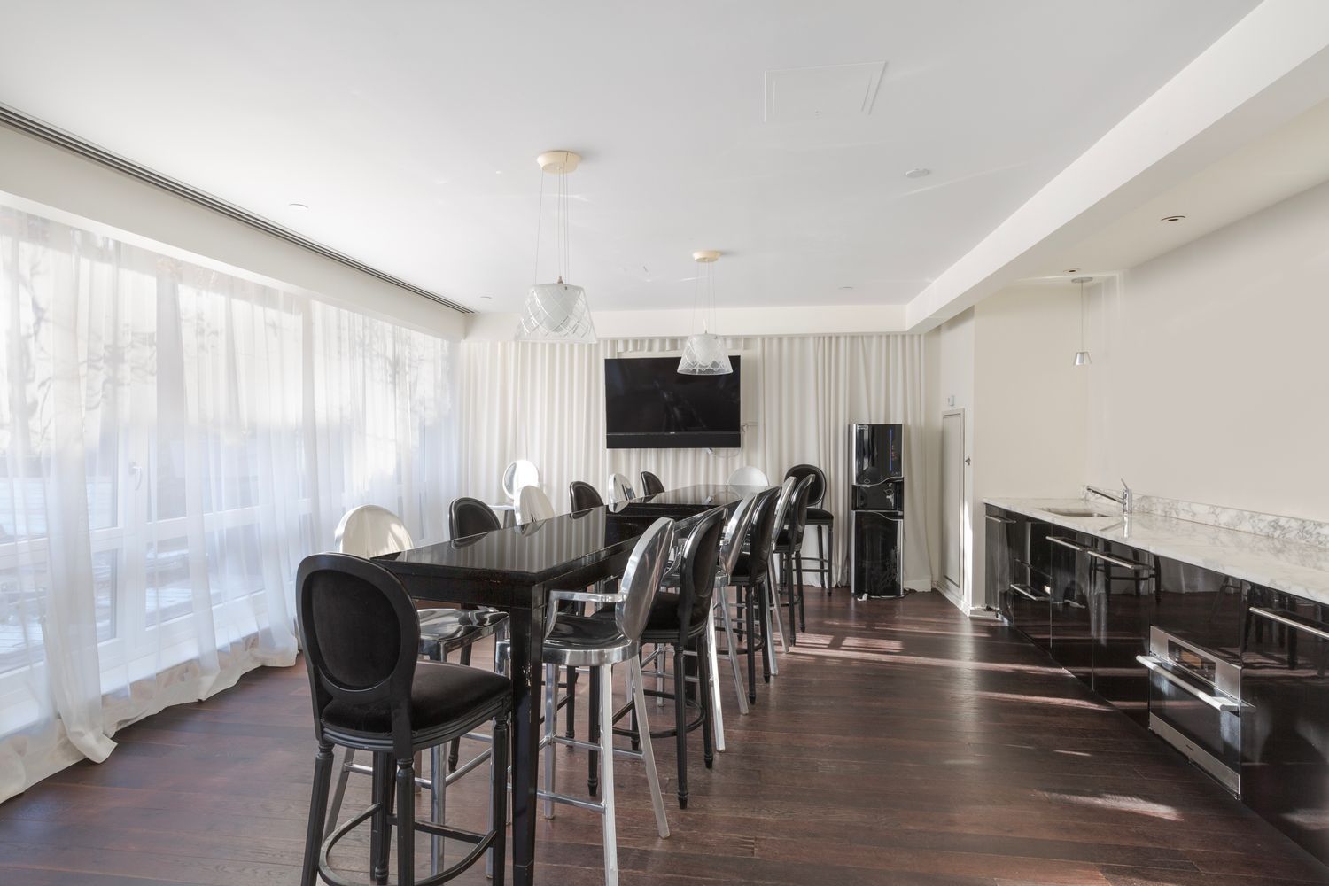 a view of a dining room with furniture and wooden floor