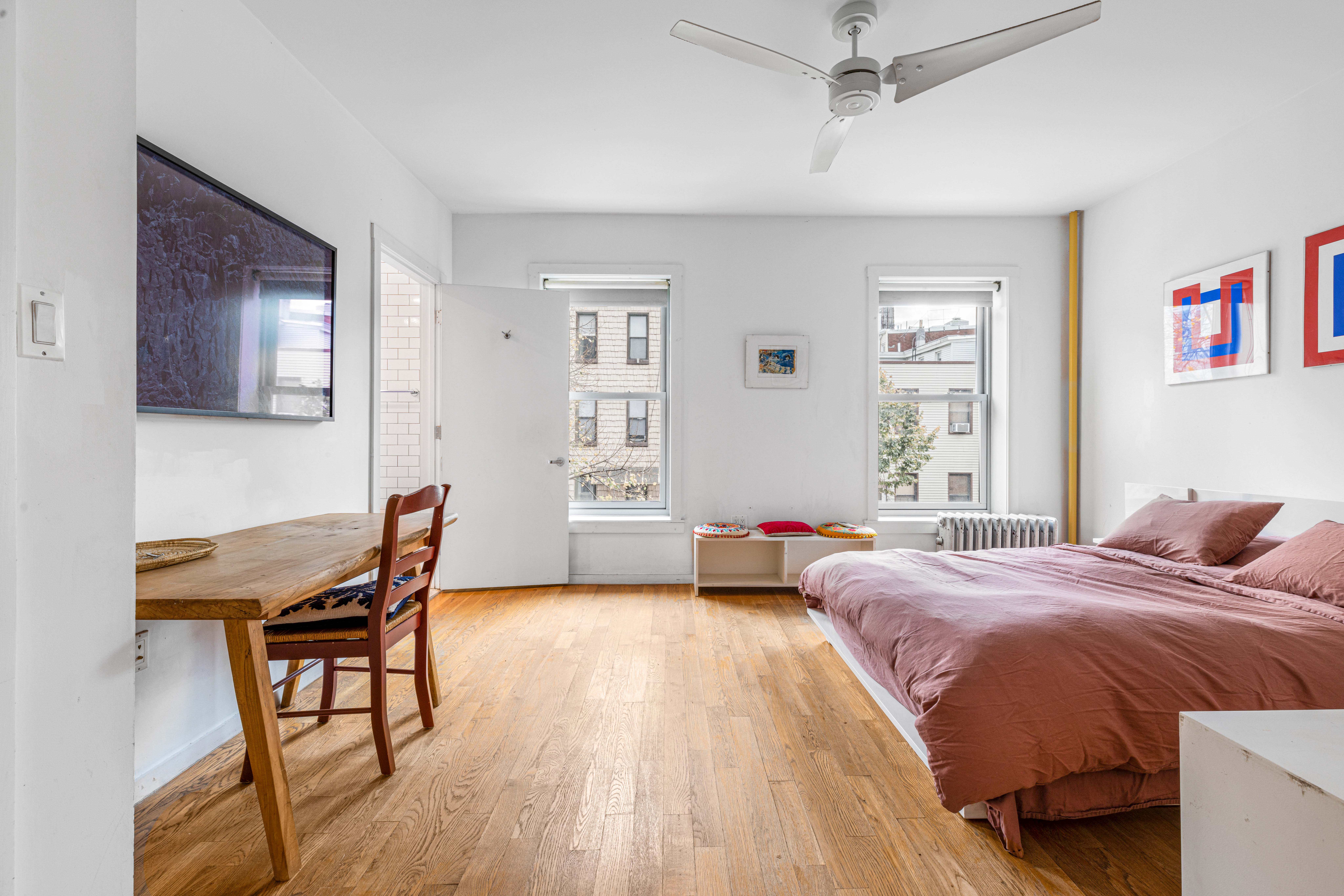 209 Calyer Street, Unit 2 Brooklyn, NY 11222 - Photo 8 of 17 a bedroom with a bed and a chair