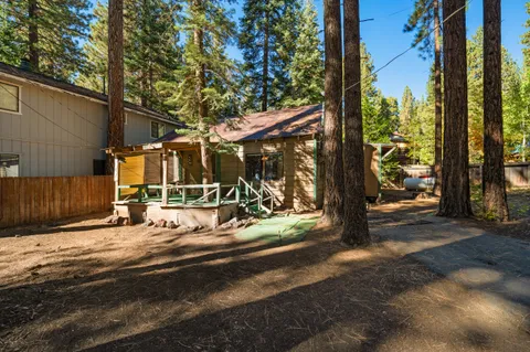 a view of a house with backyard porch and sitting area