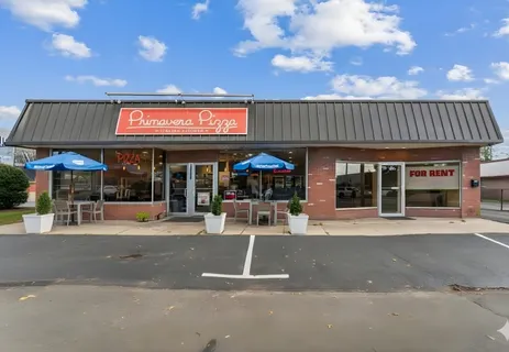 a view of a cafe with a table and chairs