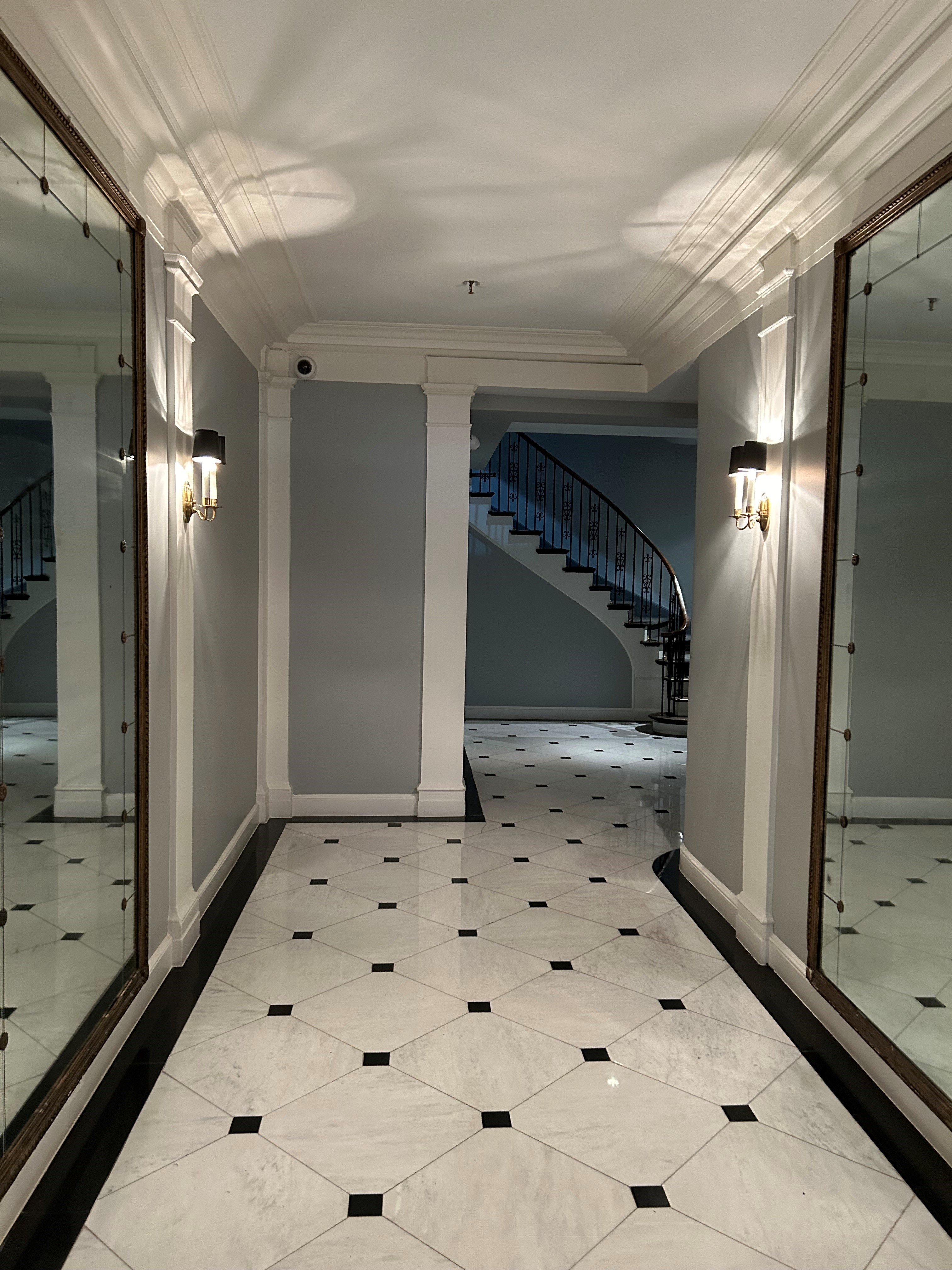 36 East 69th Street, Unit 2AB Manhattan, NY 10021 - Photo 3 of 26 a bathroom with a sink and a mirror
