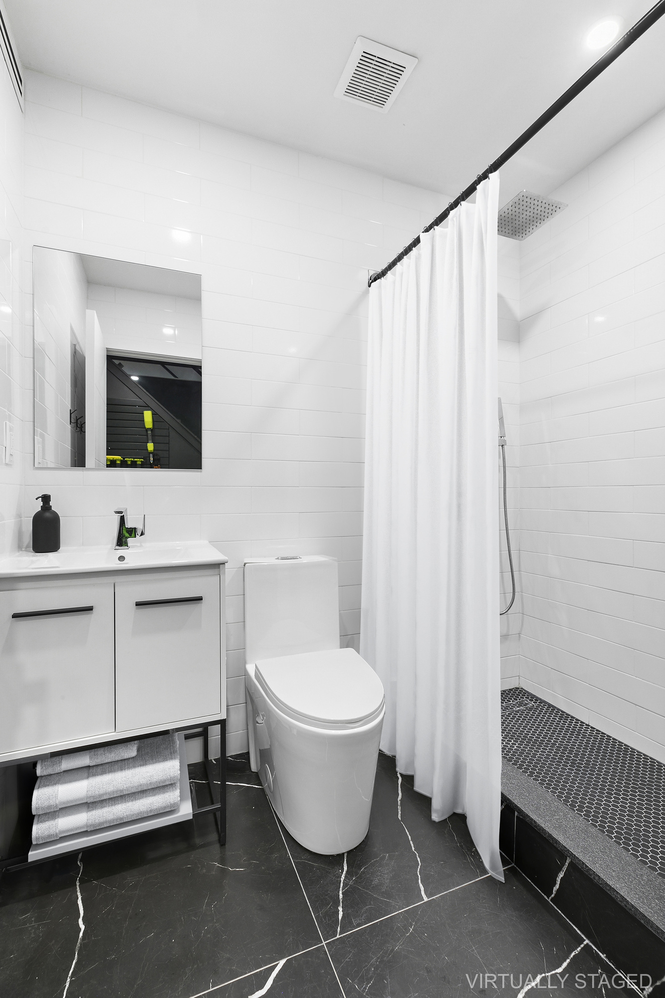 483 Hart Street, Unit 1 Brooklyn, NY 11221 - Photo 13 of 18 a bathroom with a sink toilet a mirror and shower