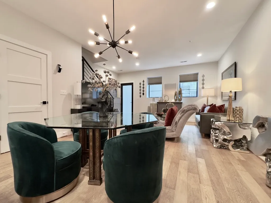 a living room with furniture potted plant and a window