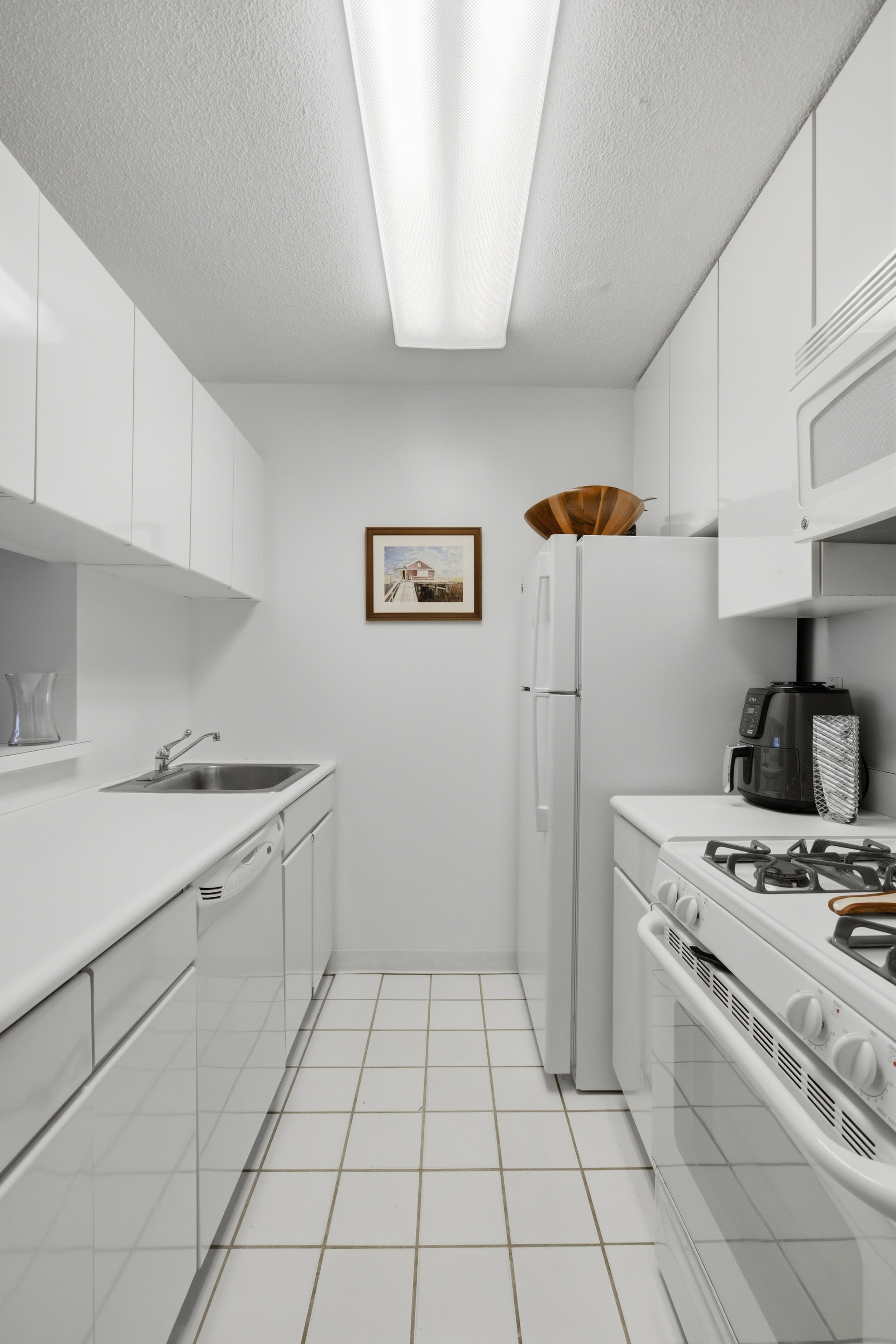 280 Park Avenue South, Unit 5L Manhattan, NY 10010 - Photo 6 of 17 a kitchen with a stove top oven and cabinets