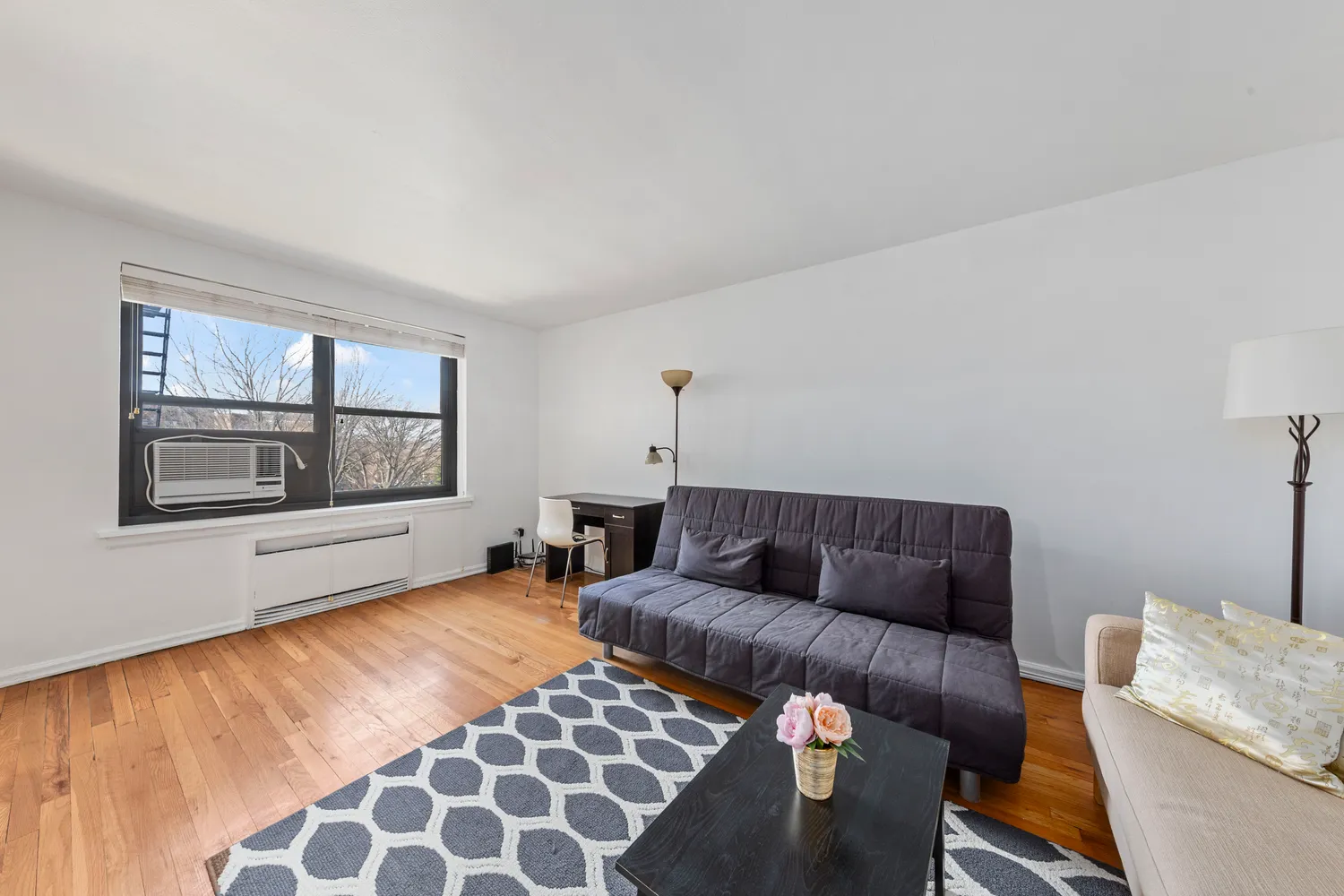 a living room with furniture and a window
