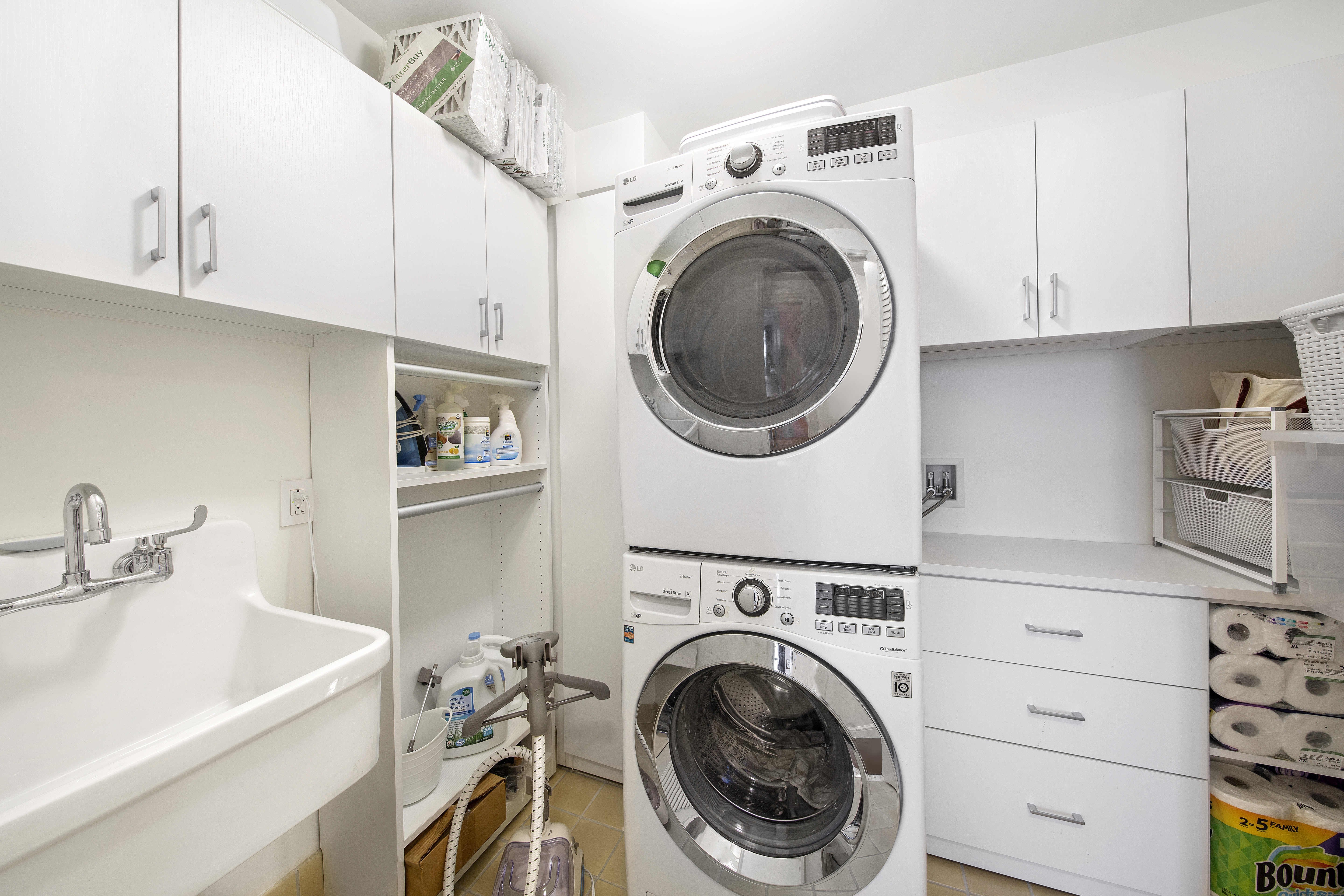 160 West 12th Street, Unit 28 Manhattan, NY 10011 - Photo 8 of 9 a view of a kitchen with sink washer and dryer