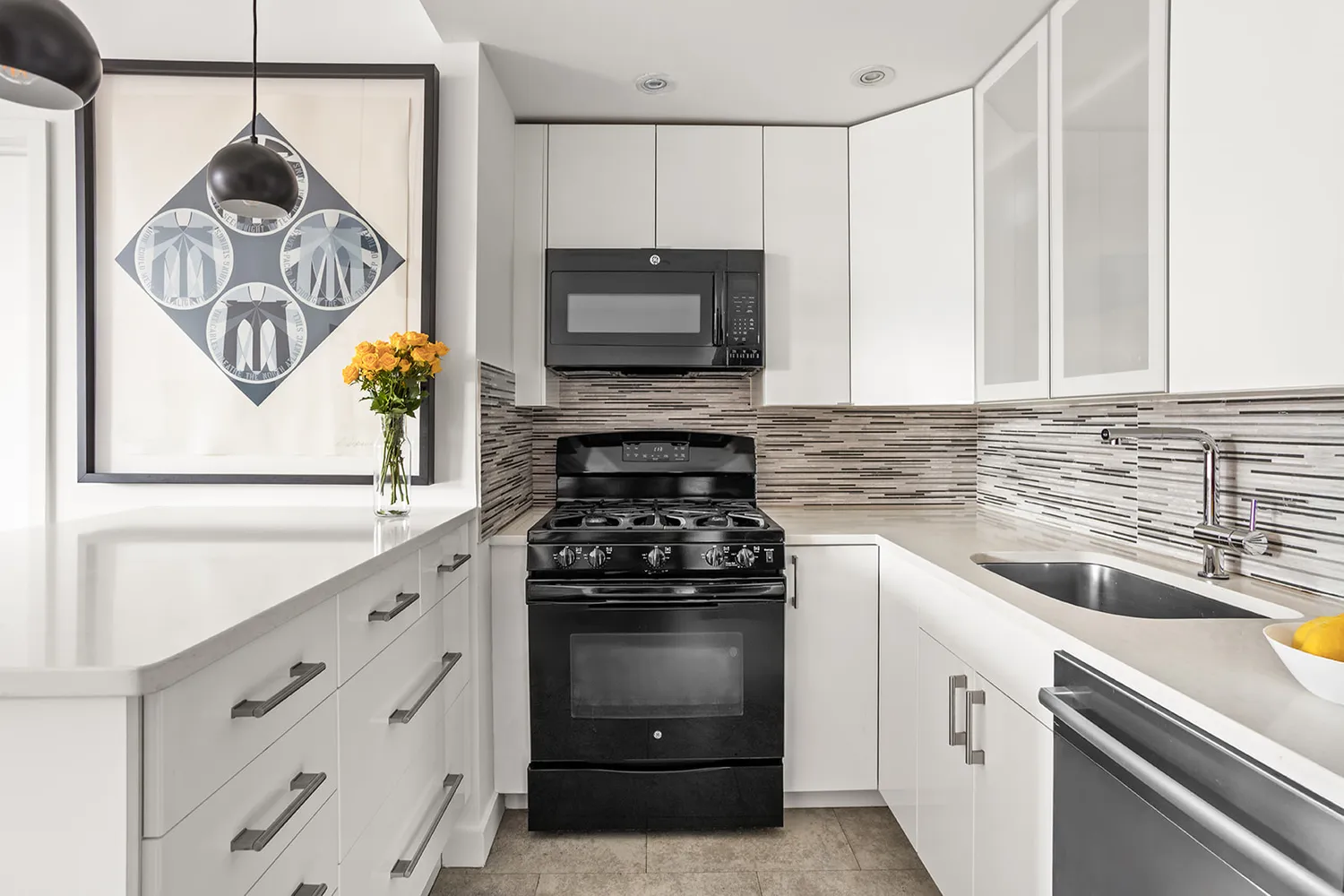 a kitchen with a stove and a white cabinets