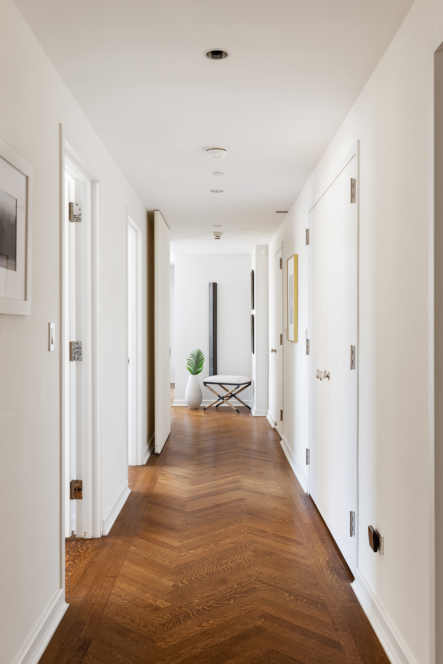 201 West 17th Street, Unit PHF Manhattan, NY 10011 - Photo 8 of 22 a view of a hallway with wooden floor and closet area