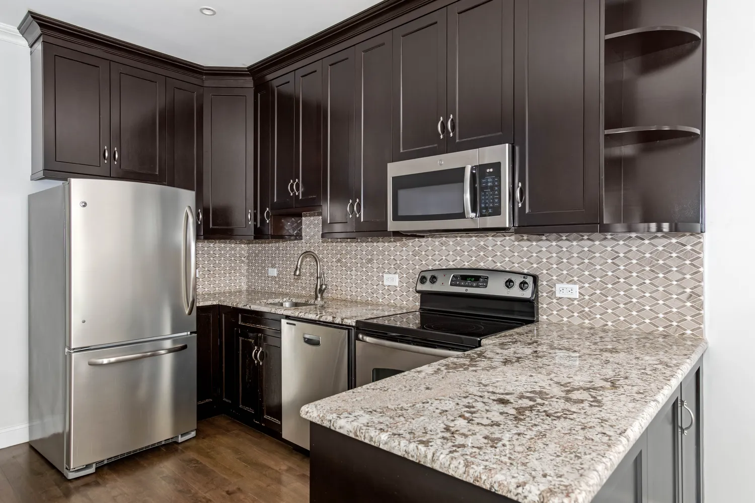 a kitchen with a sink stove and refrigerator