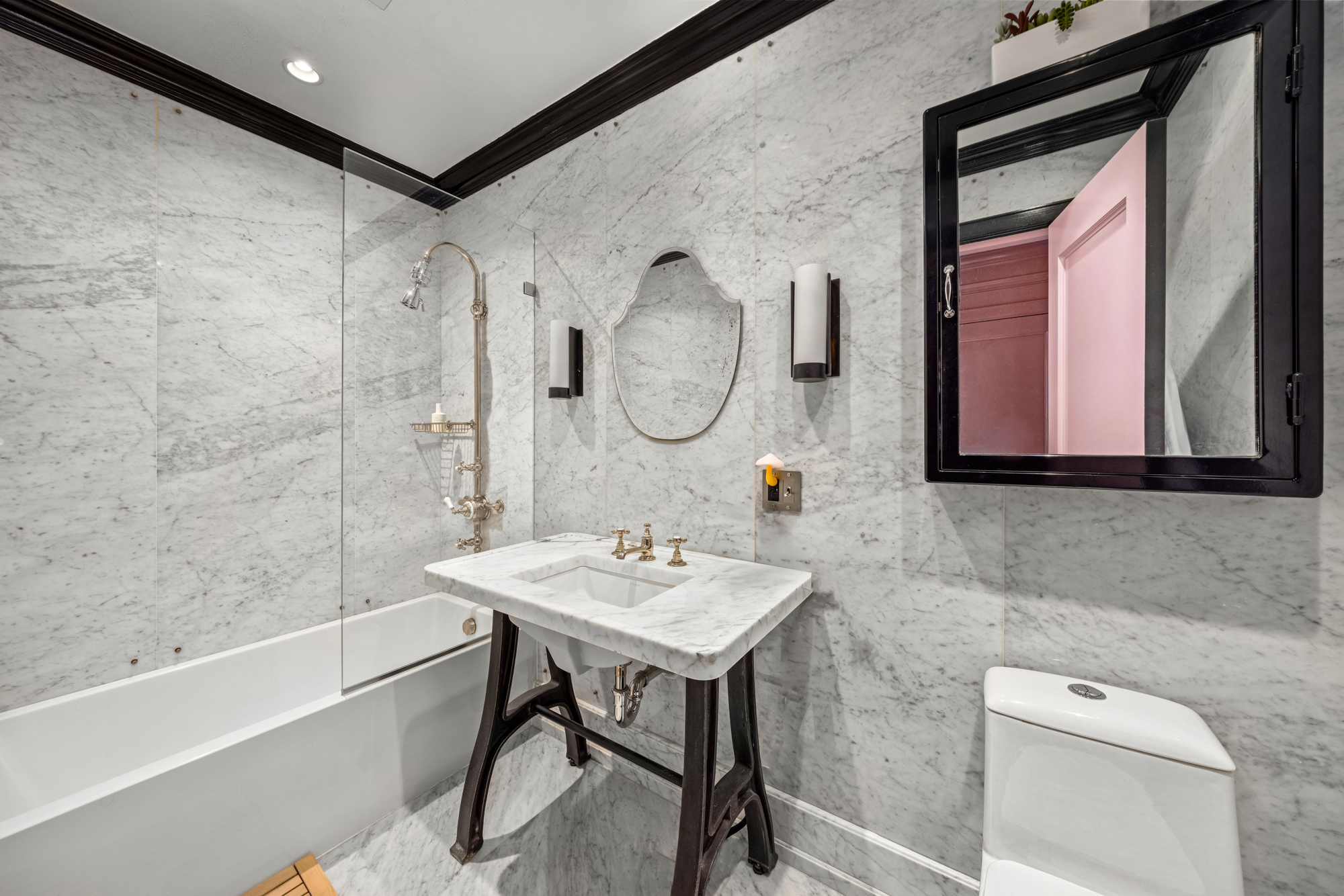 25 Prince Street, Unit 2A Manhattan, NY 10012 - Photo 9 of 11 a bathroom with a sink vanity tub and a mirror