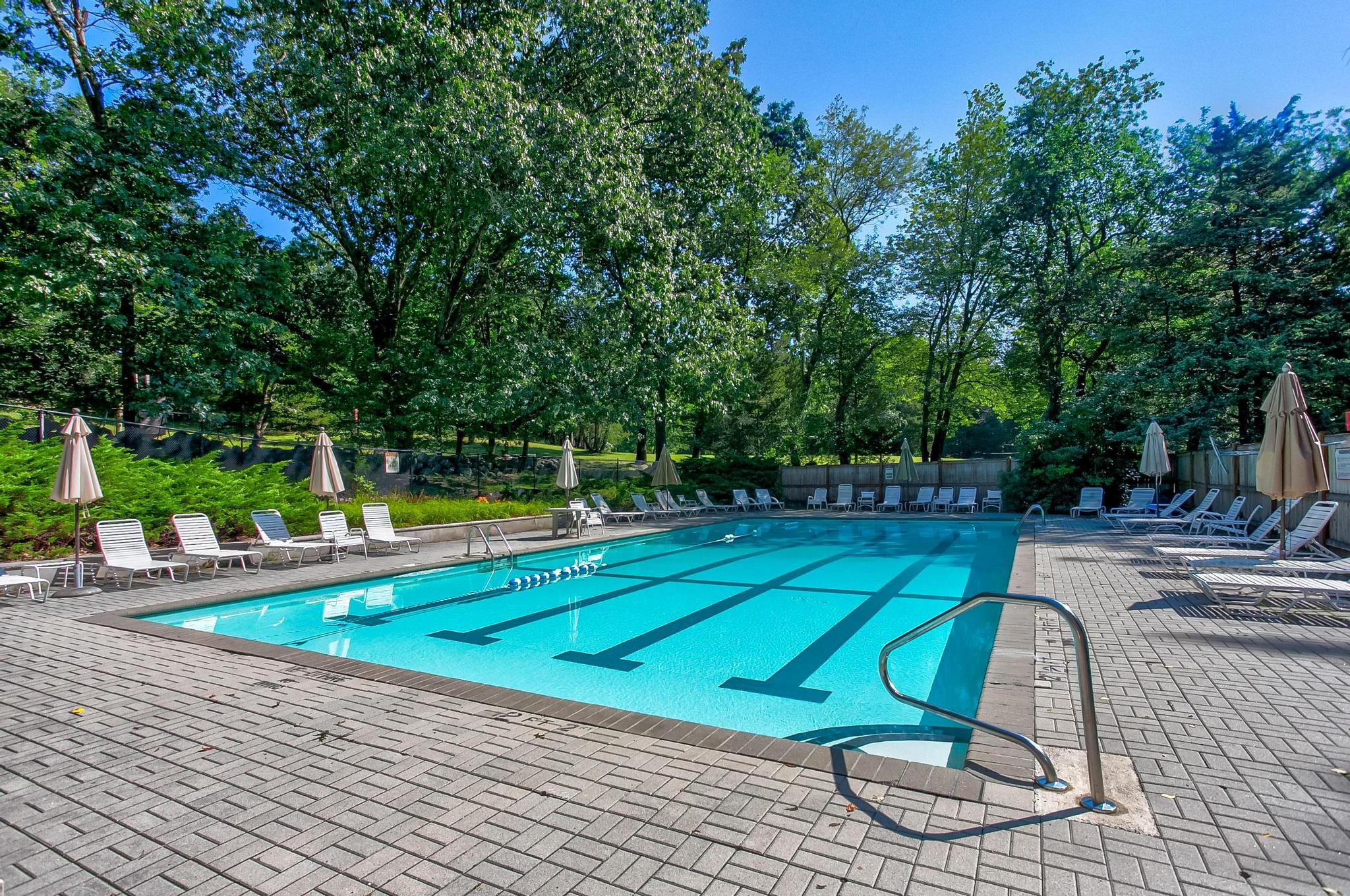 14 Barberry Road Lexington, MA 02421 - Photo 23 of 30 a view of a swimming pool with a lounge chair