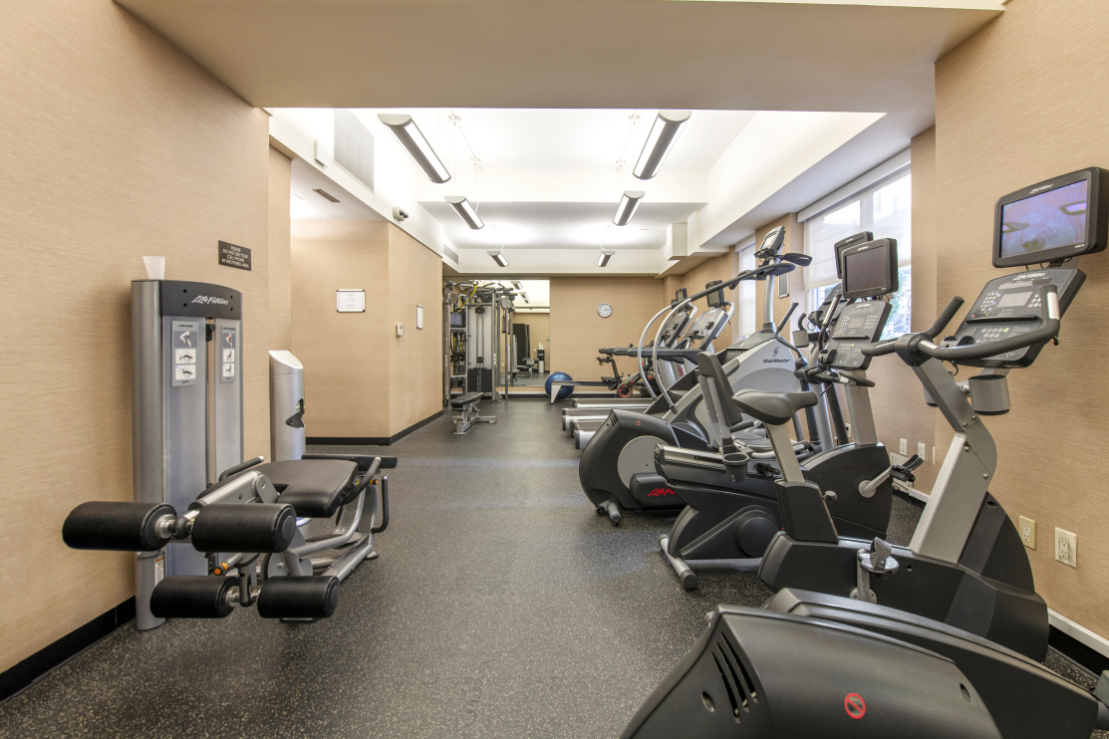 155 West 68th Street, Unit 815 Manhattan, NY 10023 - Photo 13 of 14 a view of a room with gym equipment