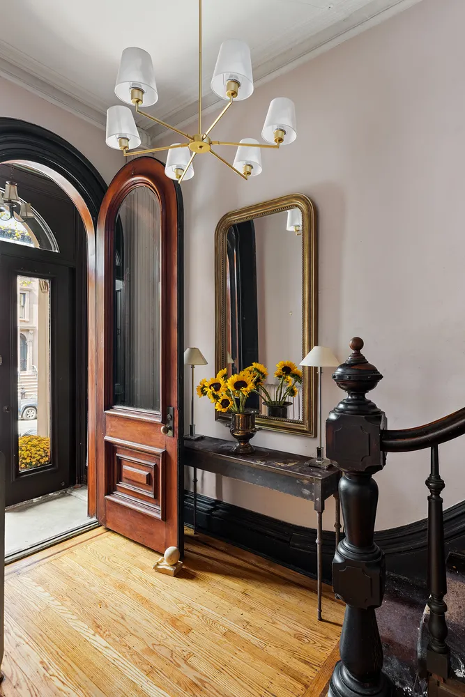 a view of living room and wooden floor