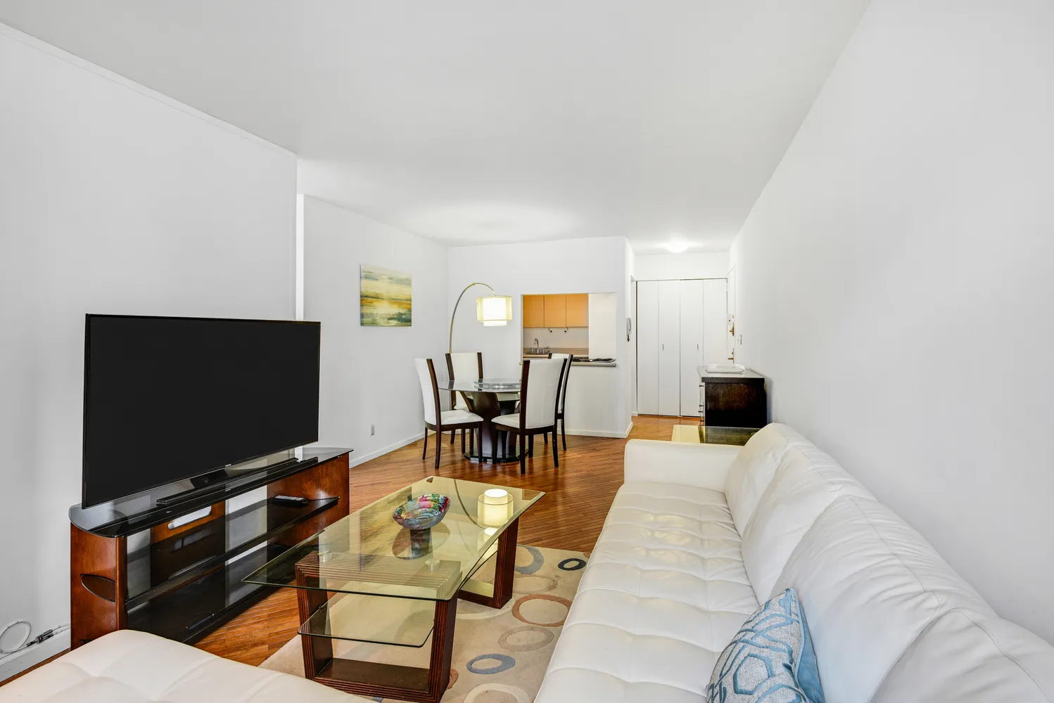 a living room with furniture and a flat screen tv