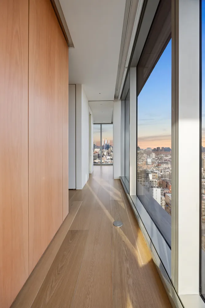 a view of an empty room and a window