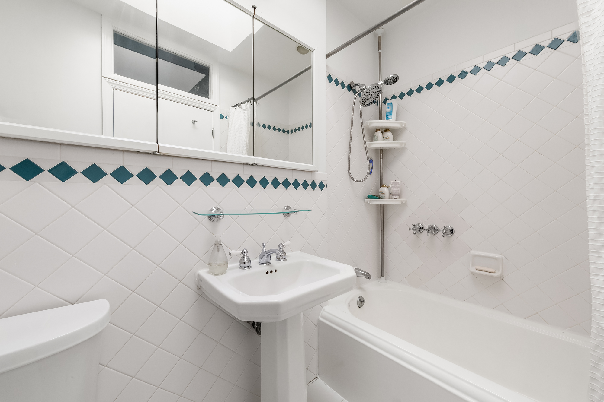 102 Clay Street, Unit 4 Brooklyn, NY 11222 - Photo 9 of 13 a bathroom with a sink a toilet and shower