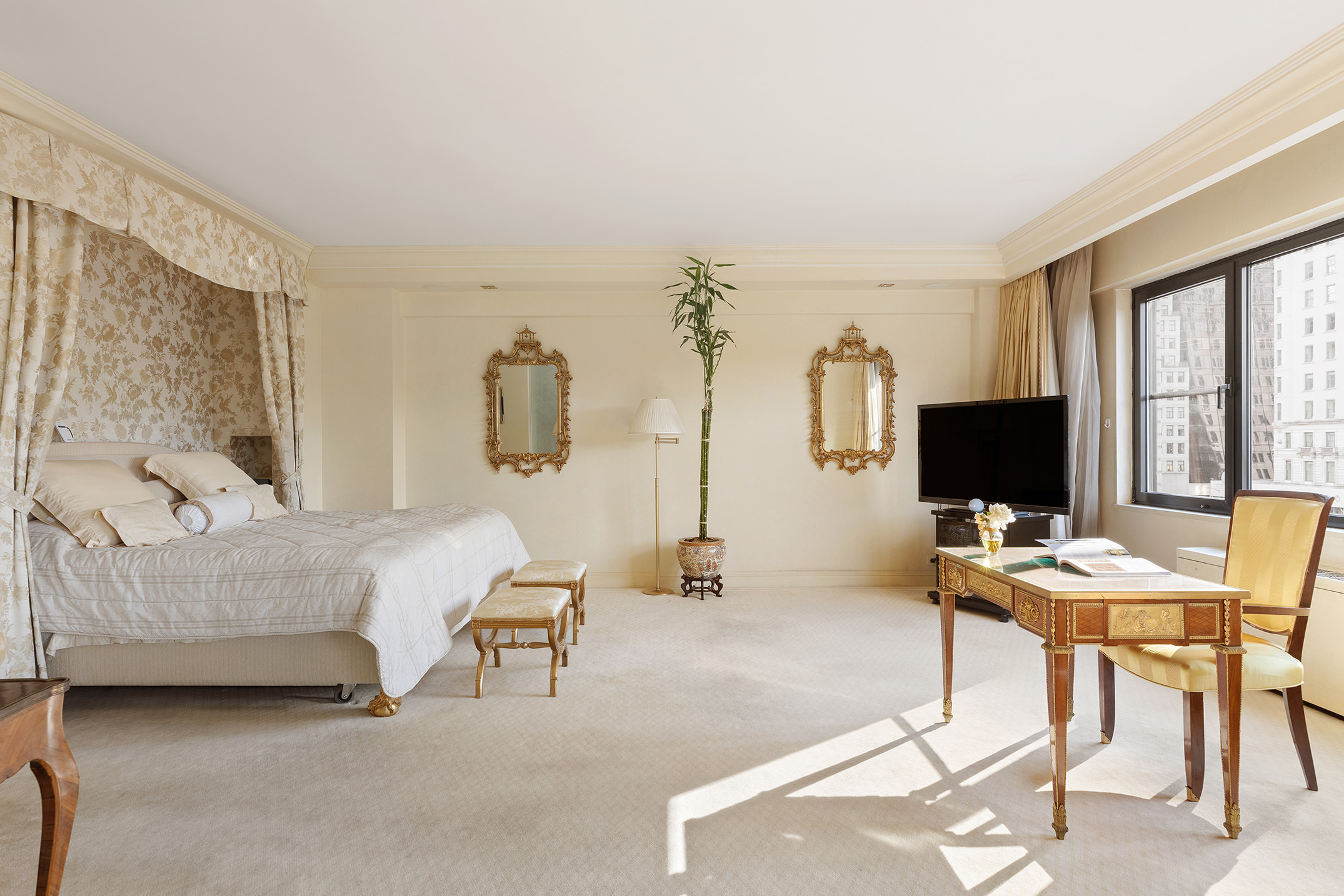 785 5th Avenue, Unit 5C Manhattan, NY 10022 - Photo 3 of 14 a living room with furniture and a flat screen tv