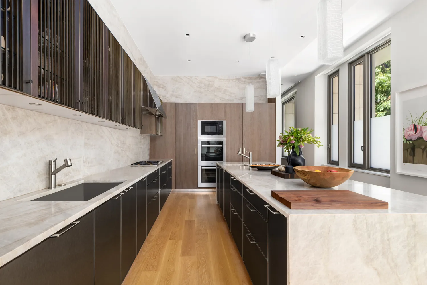 a kitchen with granite countertop a sink stove and cabinets