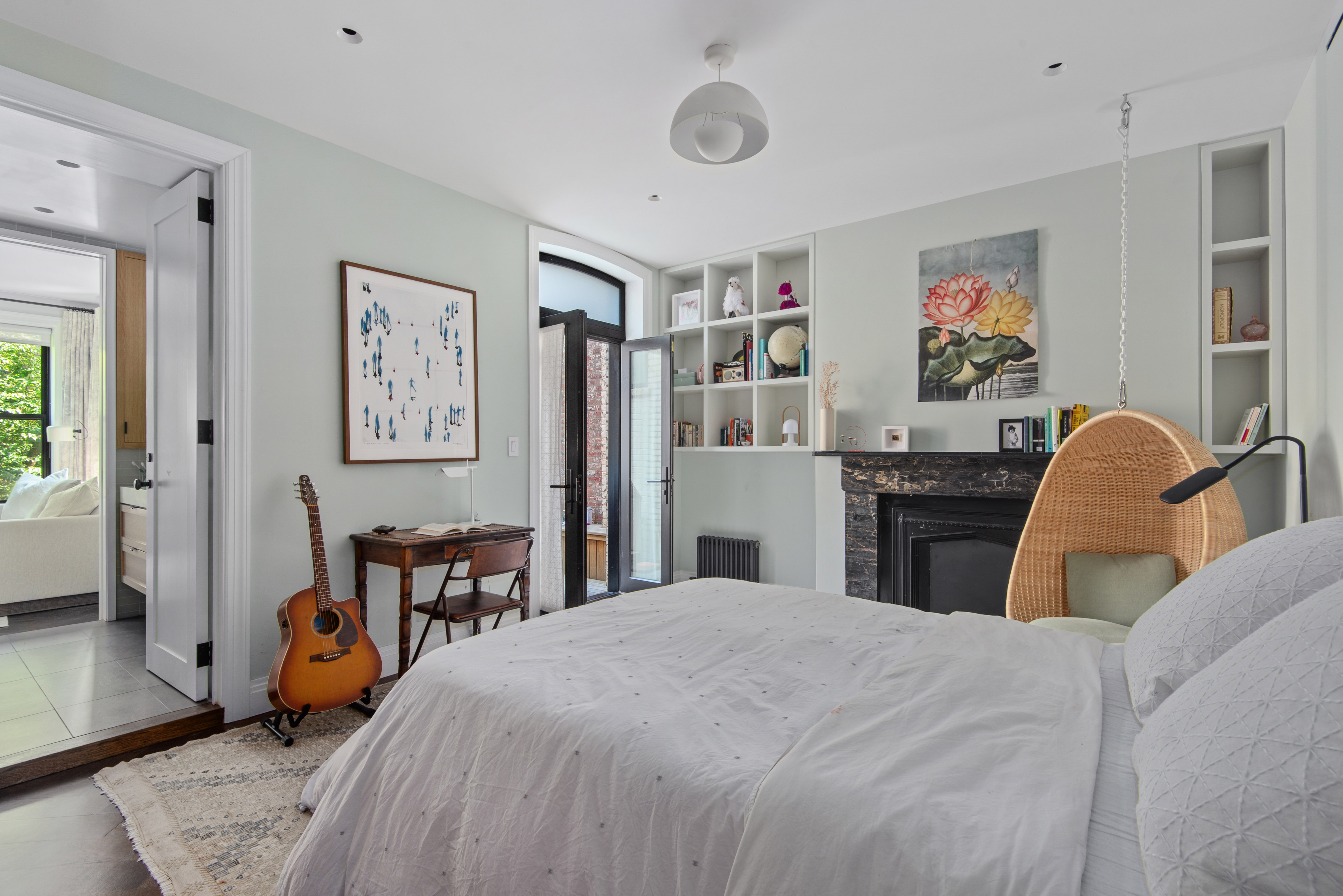 9 Garden Place, Unit 2 Brooklyn, NY 11201 - Photo 10 of 18 a bedroom with a bed a table and painting on the wall