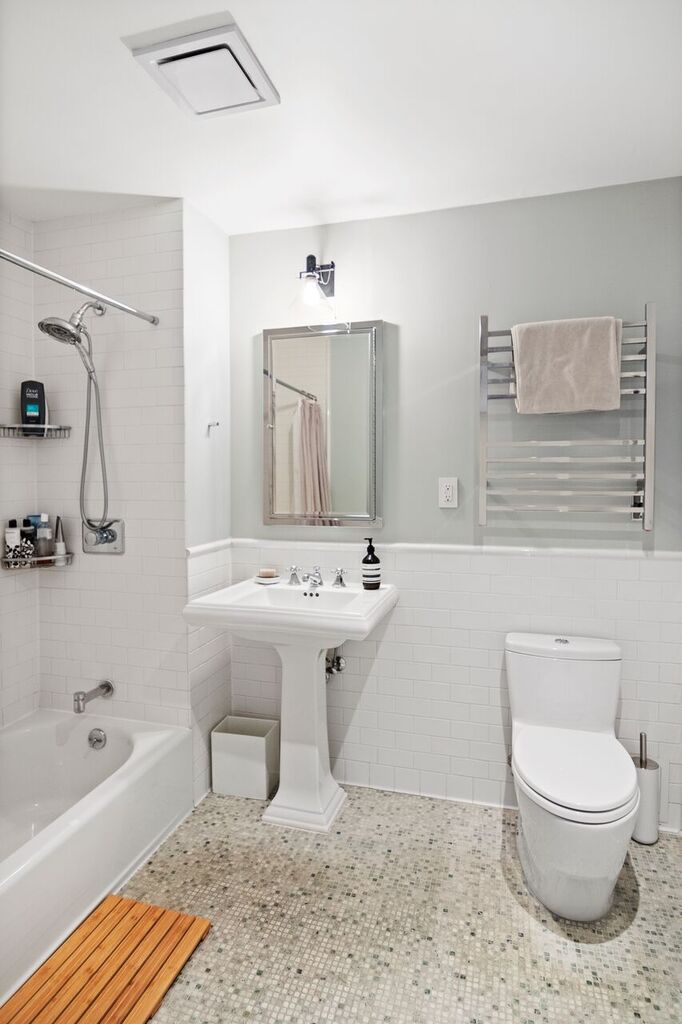 224 West 18th Street, Unit 6C Manhattan, NY 10011 - Photo 14 of 21 a bathroom with a sink toilet bathtub and shower