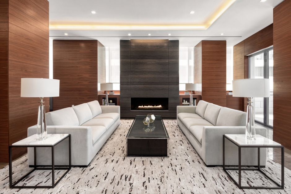 1 West End Avenue, Unit 27D Manhattan, NY 10023 - Photo 19 of 21 a living room with furniture and a lamp