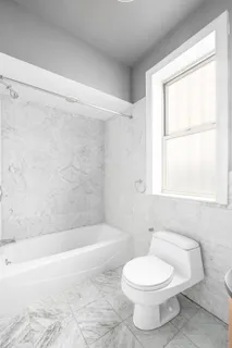 a bathroom with a toilet a sink and a bathtub
