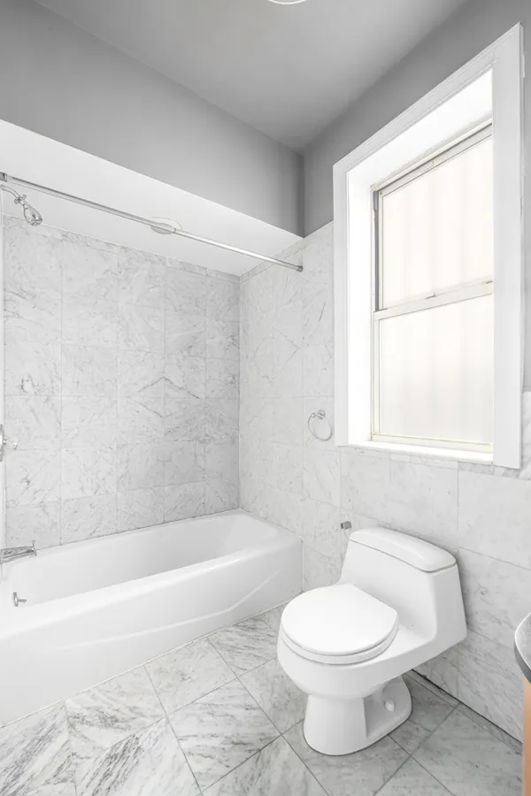 a bathroom with a toilet a sink and a bathtub