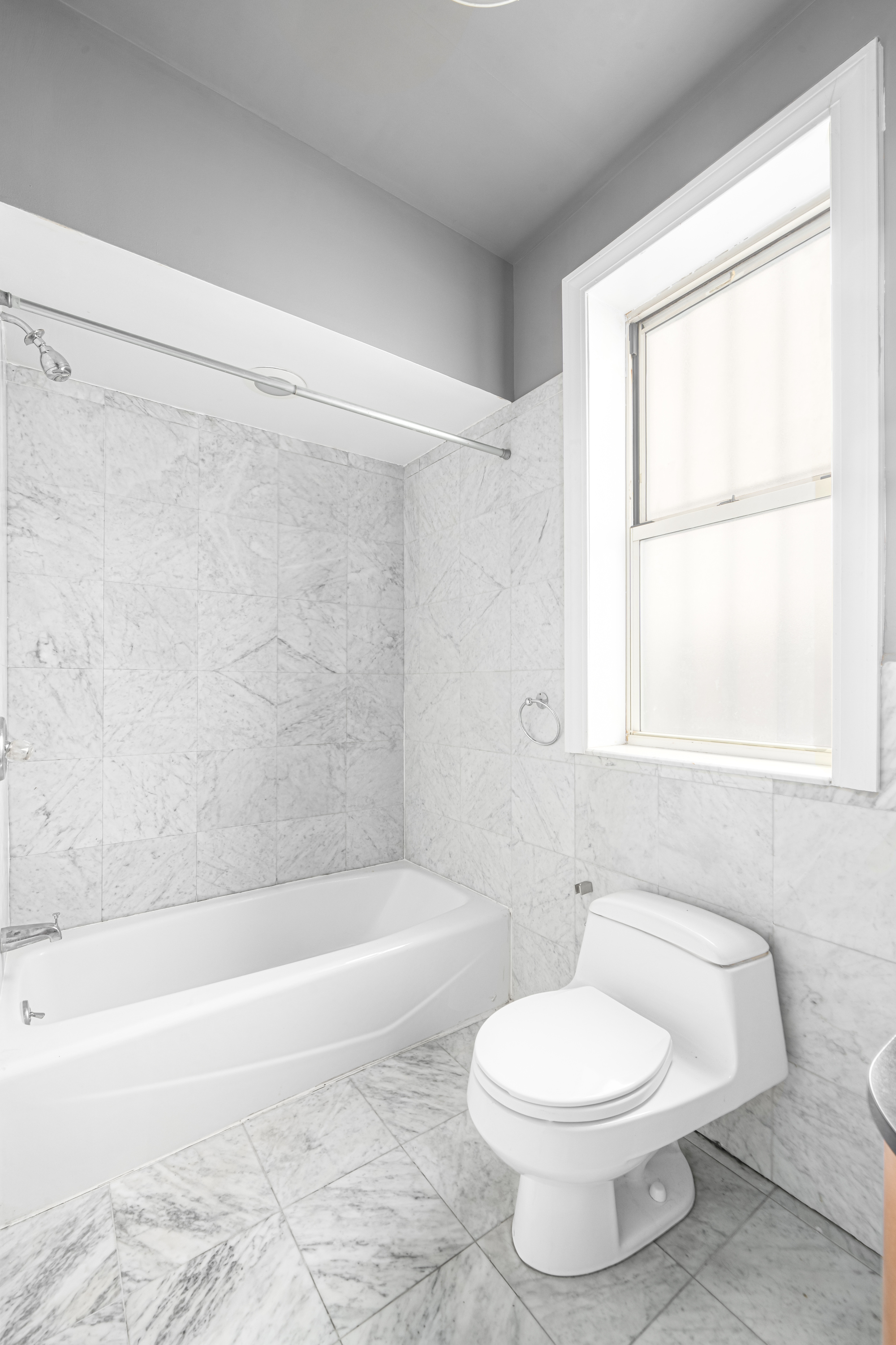212 West 85th Street, Unit 5W Manhattan, NY 10024 - Photo 6 of 11 a bathroom with a toilet a sink and a bathtub
