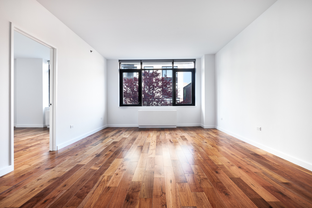 125 North 5th Street, Unit 2A Brooklyn, NY 11249 - Photo 1 of 10 a view of an empty room with wooden floor and a window