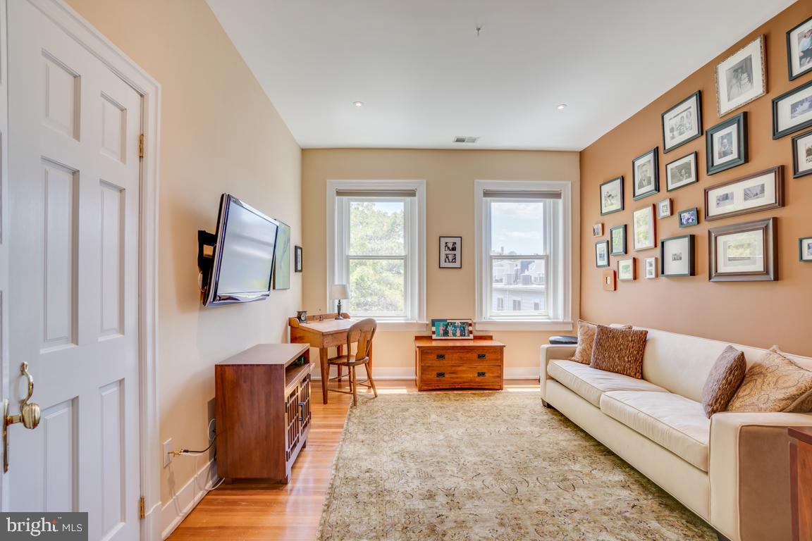 2415 20th Street Northwest, Unit 38 Washington, DC 20009 - Photo 21 of 30 a living room with furniture and a flat screen tv