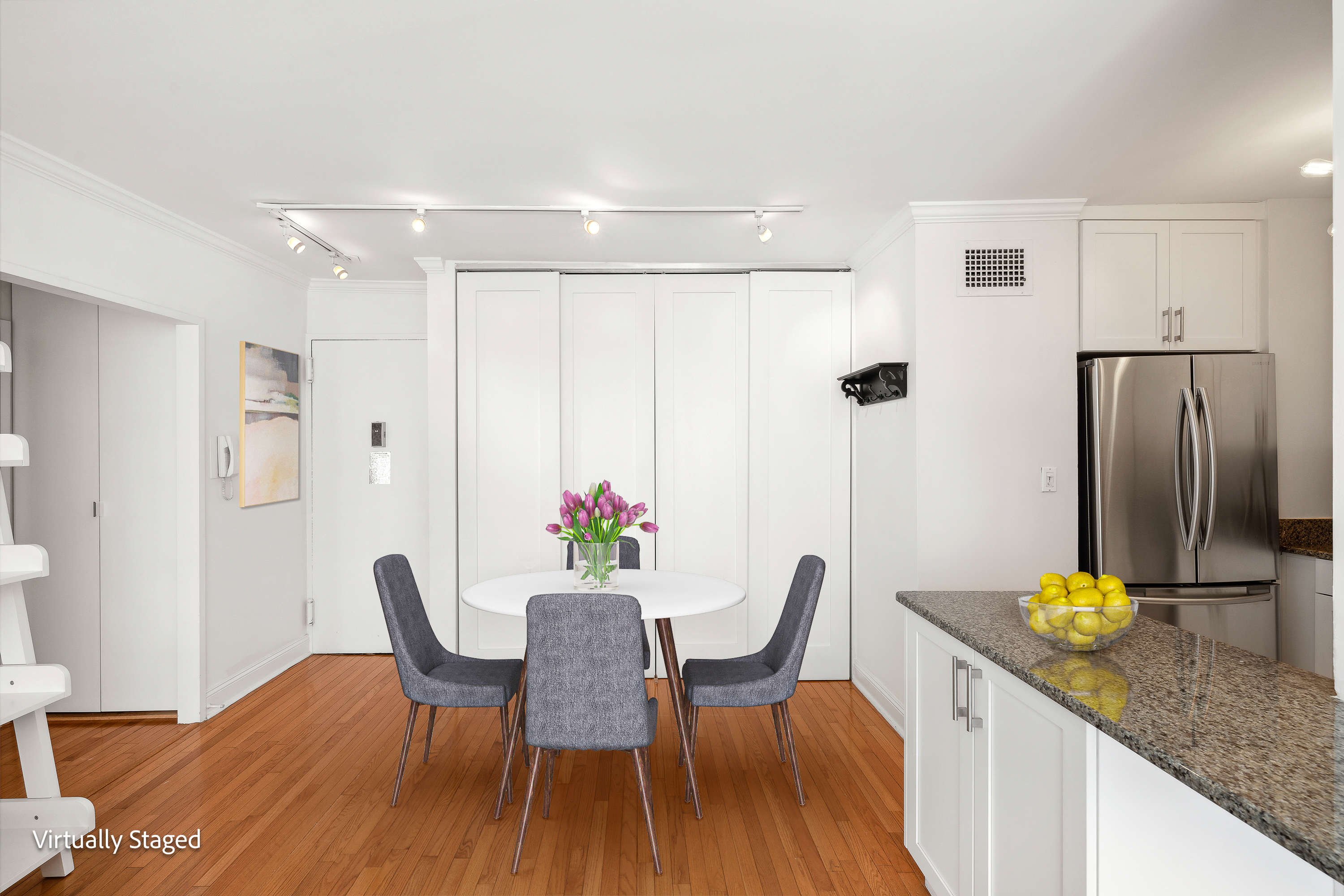 301 East 87th Street, Unit 16E Manhattan, NY 10128 - Photo 4 of 16 a view of a dining room with furniture