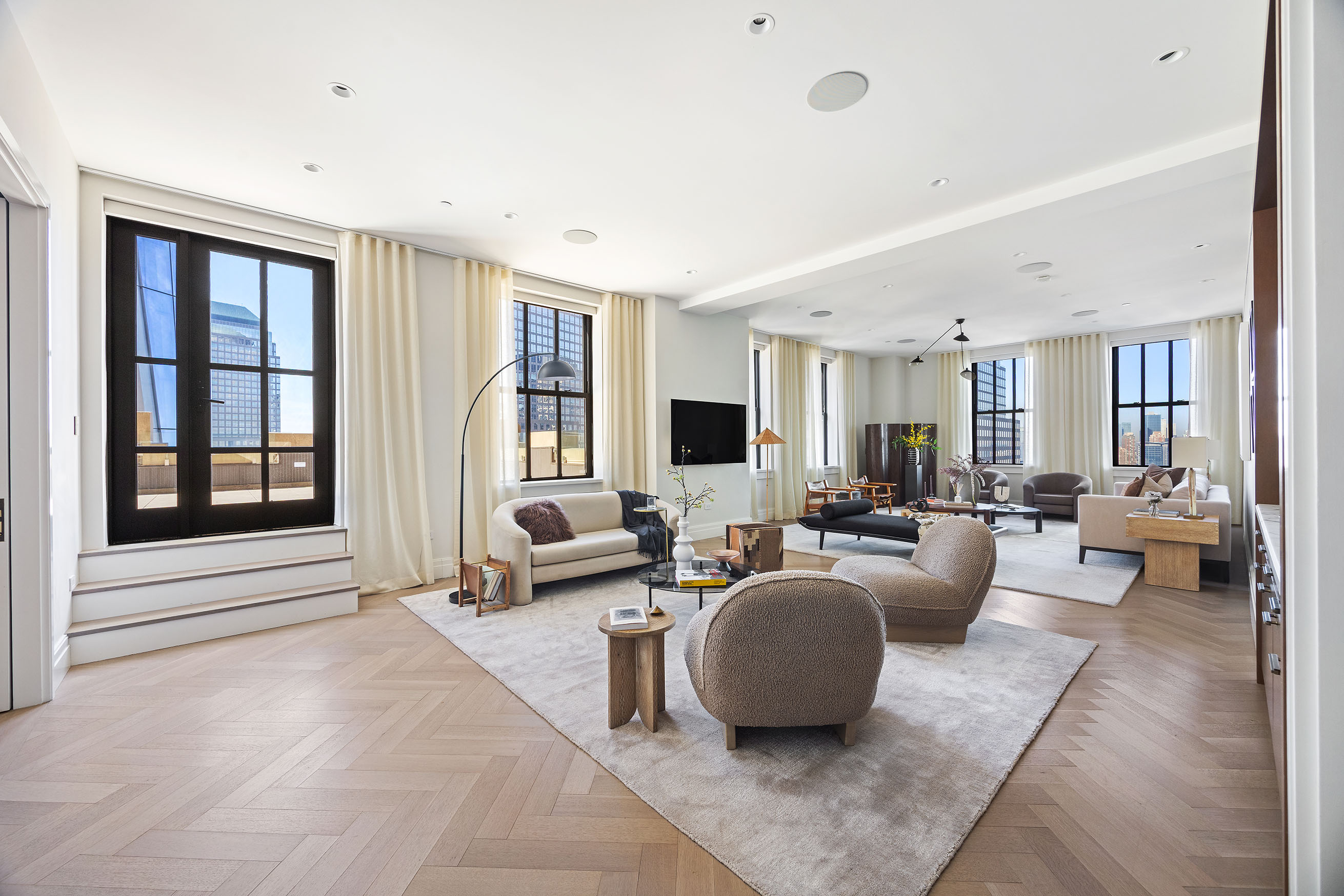 100 Barclay Street, Unit 21AD Manhattan, NY 10007 - Photo 3 of 37 a living room with furniture large window and flat screen tv