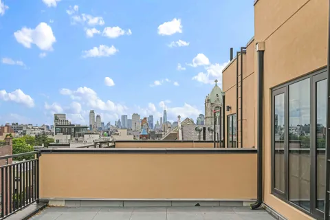 a view of a balcony with city view