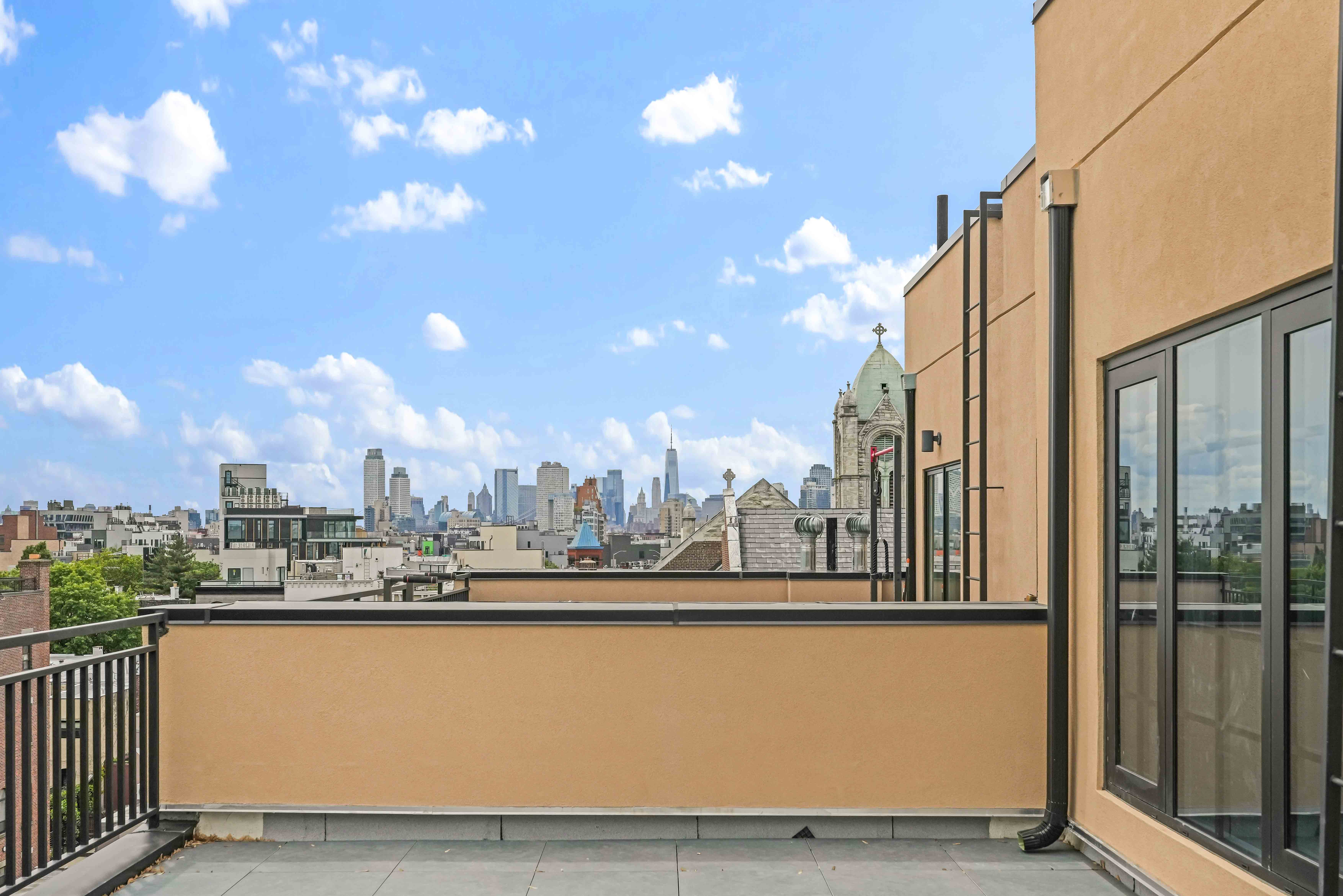 90 Herbert Street, Unit PHB Brooklyn, NY 11222 - Photo 12 of 15 a view of a balcony with city view
