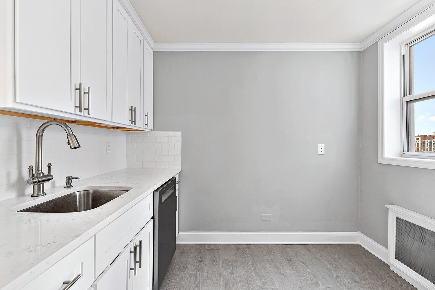 a kitchen with a sink and cabinets