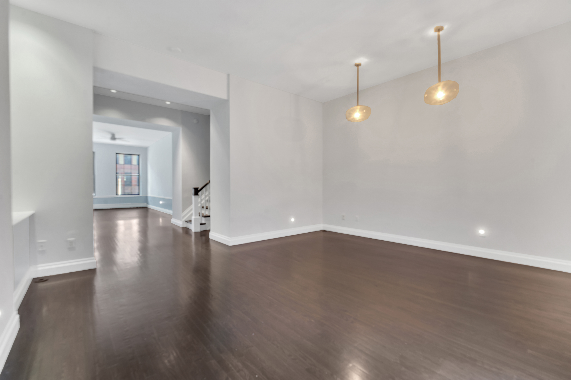 710 St Nicholas Avenue, Unit 2 Manhattan, NY 10031 - Photo 6 of 12 a view of a room with wooden floor and fireplace