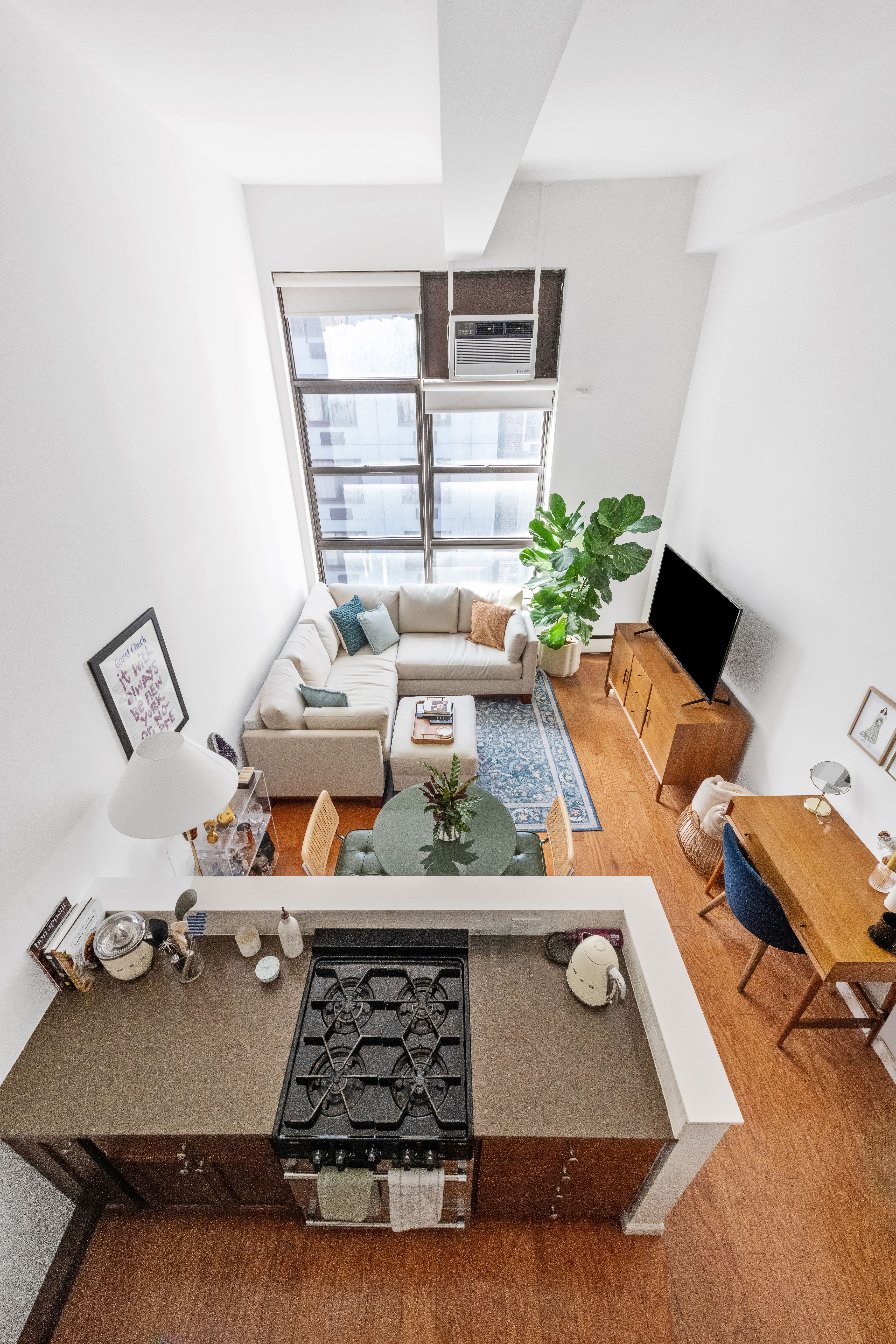 350 East 62nd Street, Unit 3J Manhattan, NY 10065 - Photo 4 of 9 a view of a workspace with furniture